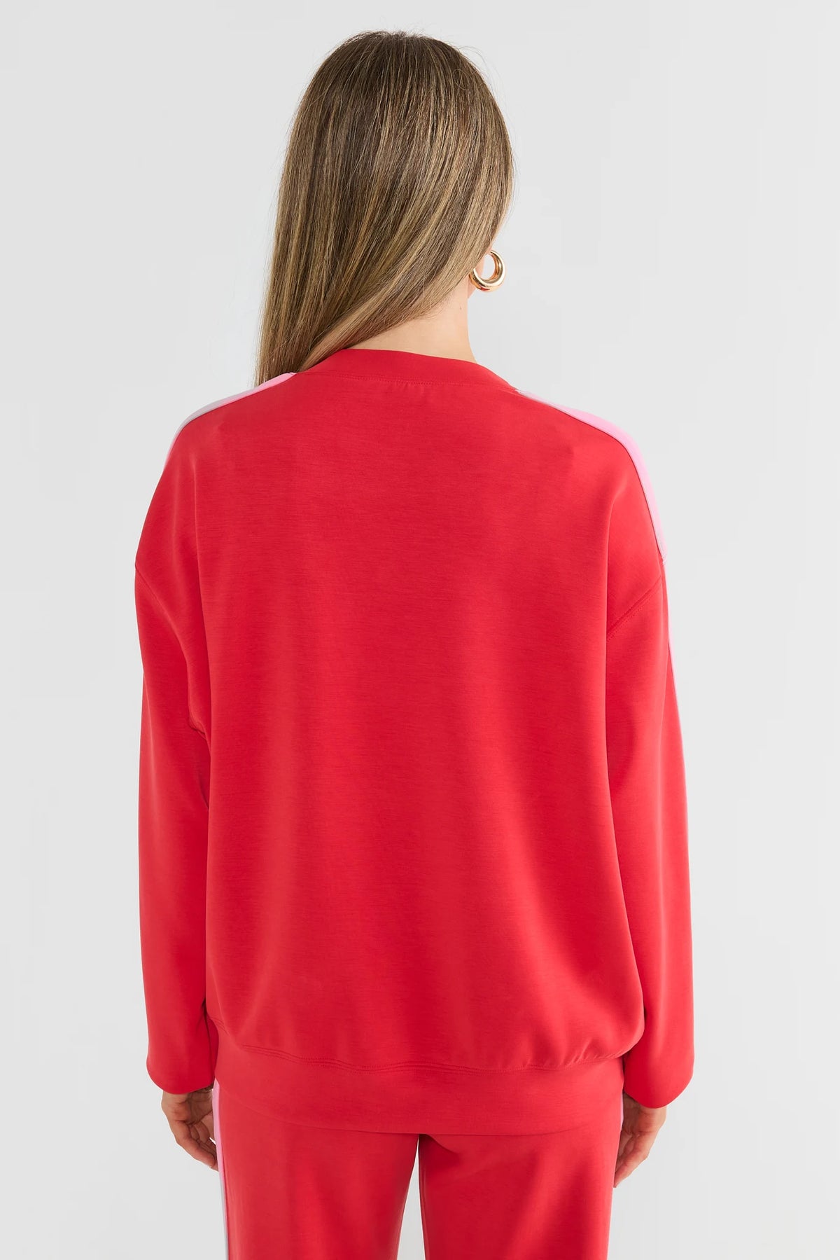 Red Relaxed Pullover Sweatshirt with Pink Shoulder Stripe - Back View | Avara