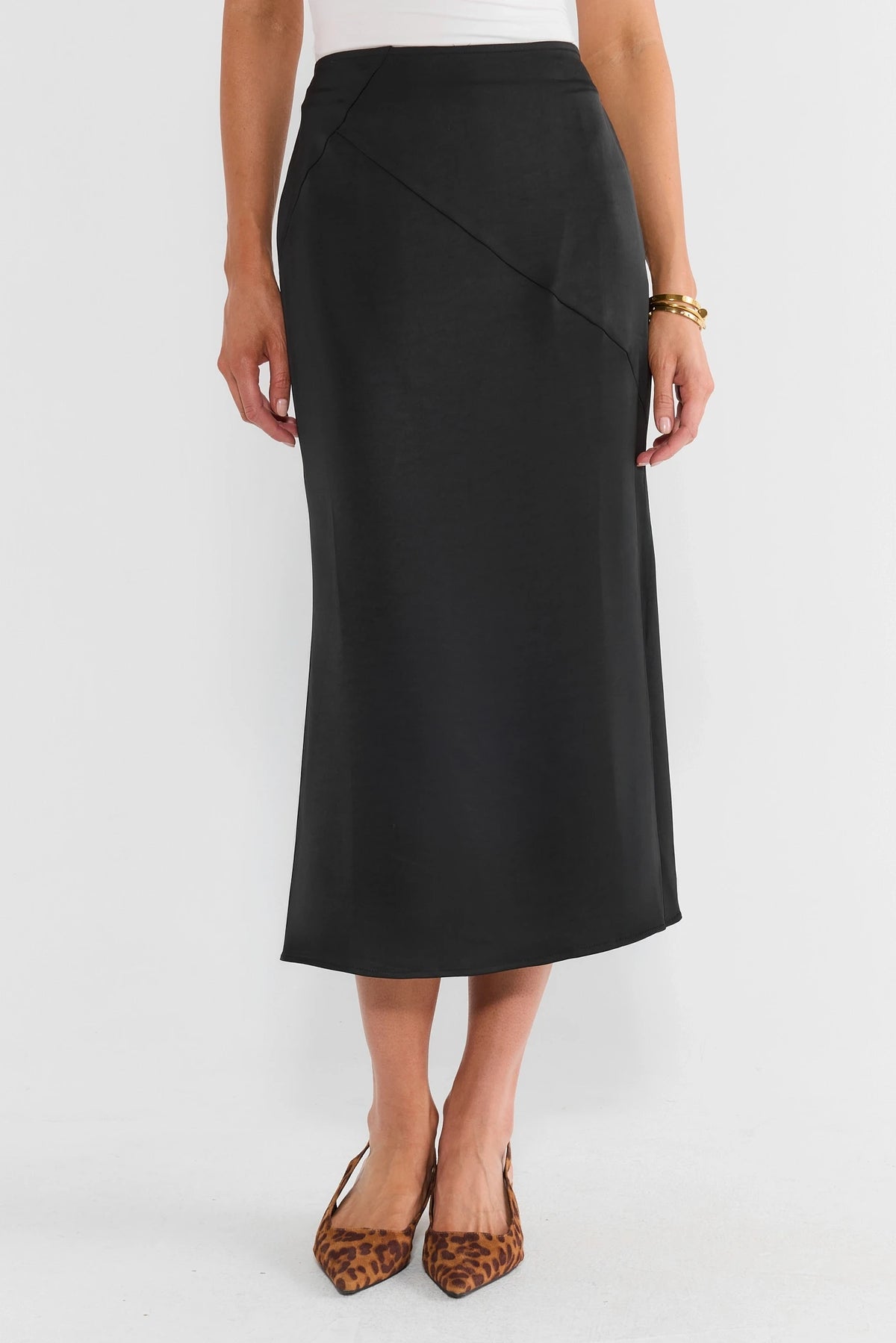 Black Satin Midi Skirt - Front View with Diagonal Seam Detail | Avara