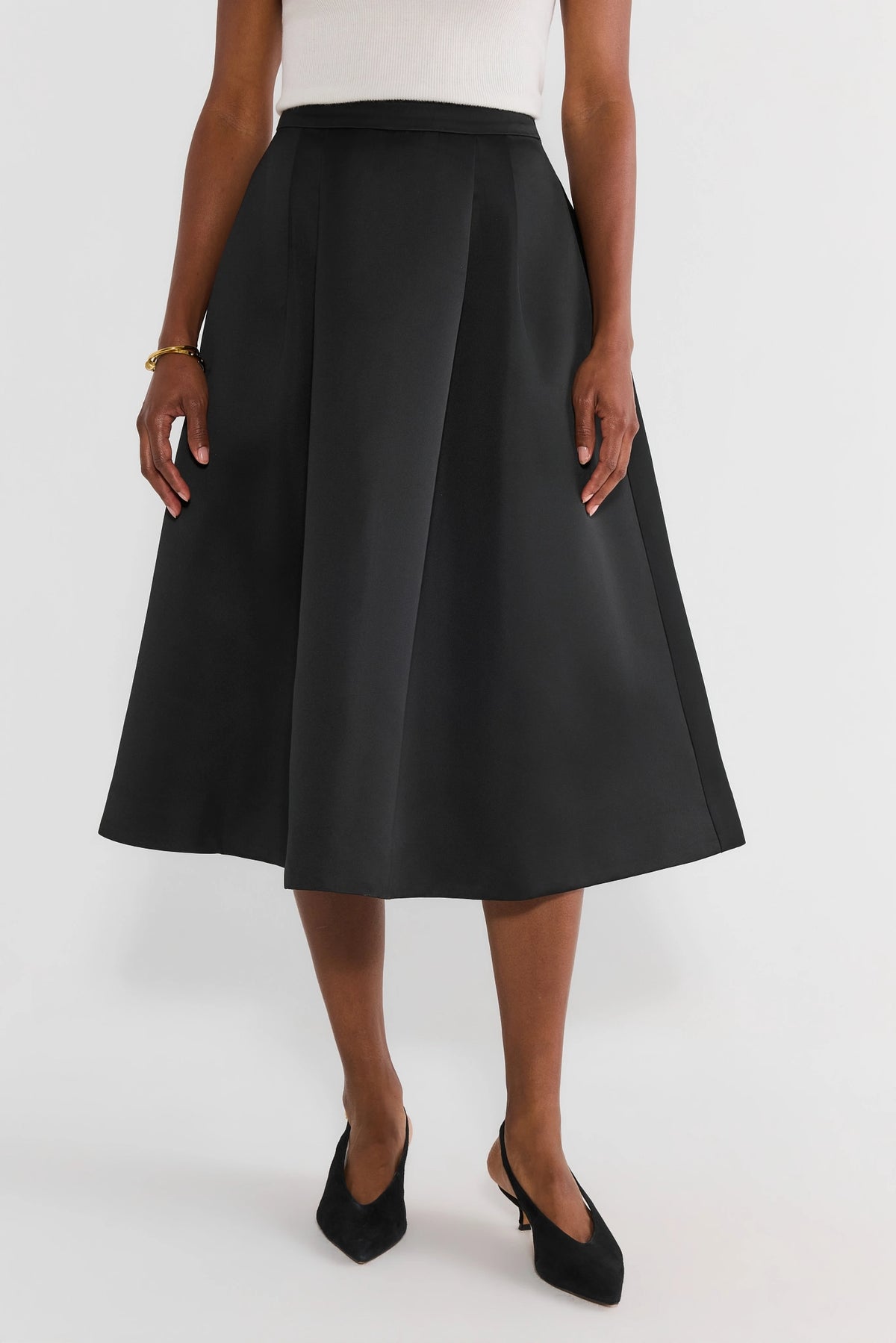 Black Pleated Midi Skirt - Front View On Model | Avara