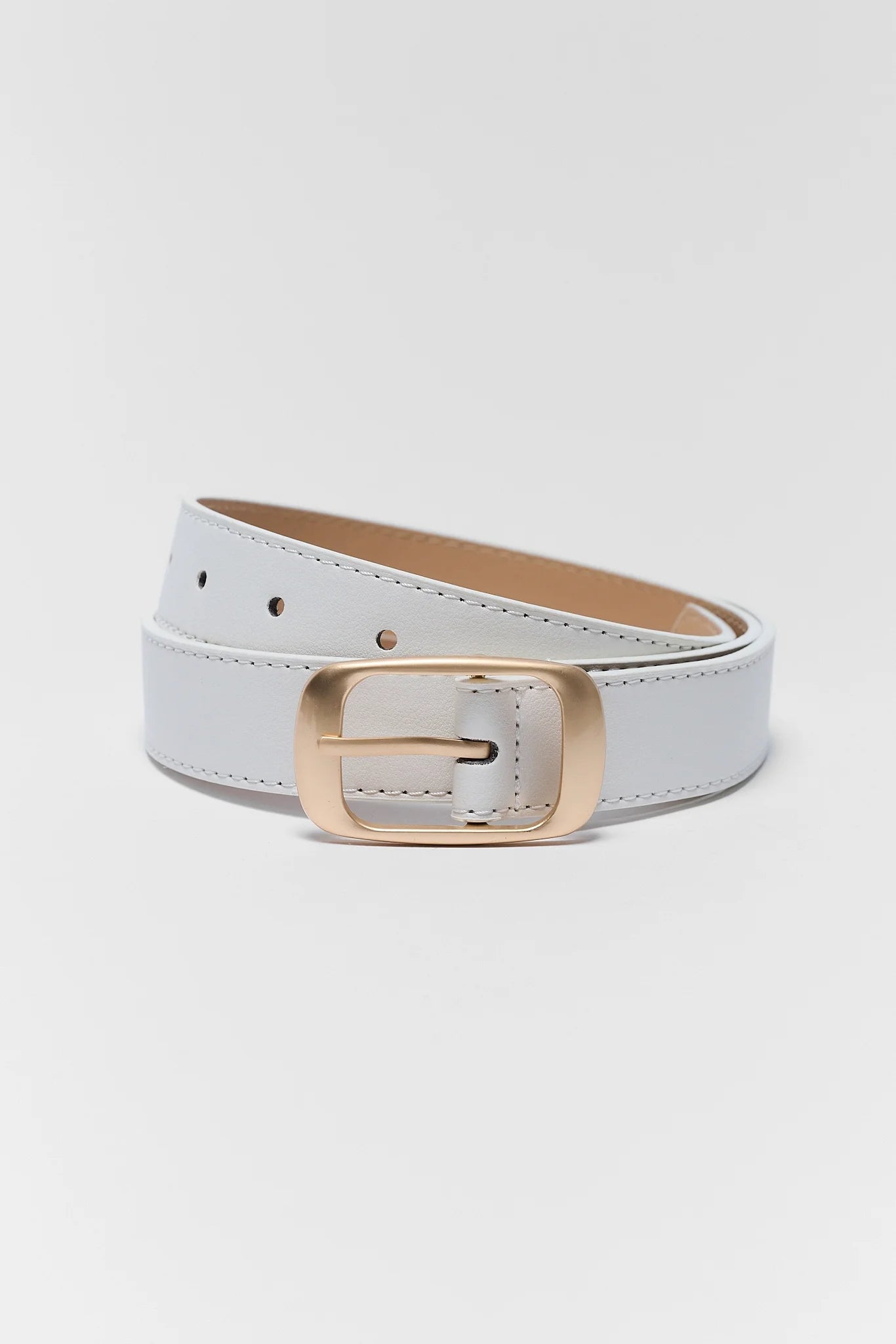 A light gray faux leather belt with a gold-tone metal buckle, coiled on a light gray background.