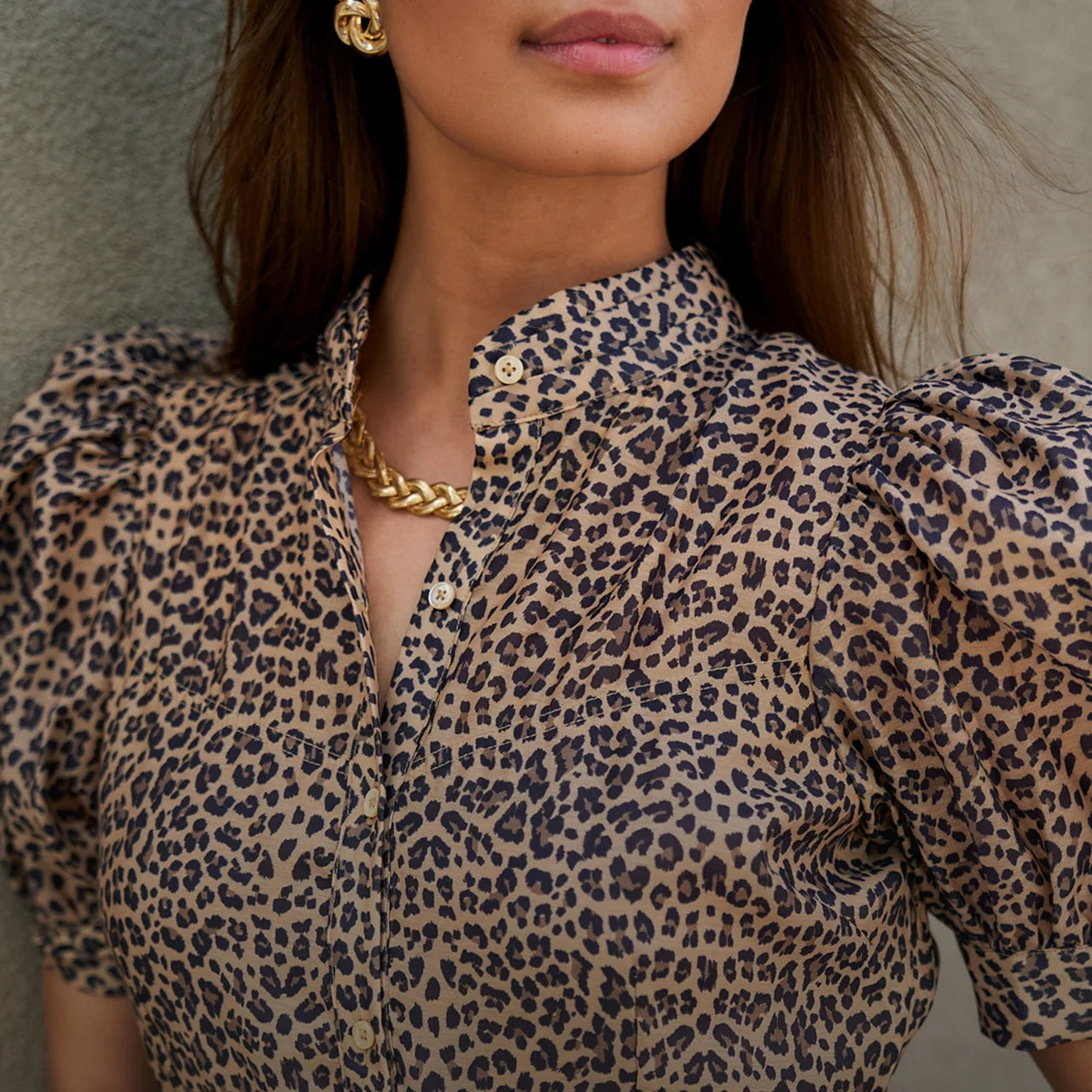 Person wearing a leopard print Martha Dress with a neutral background