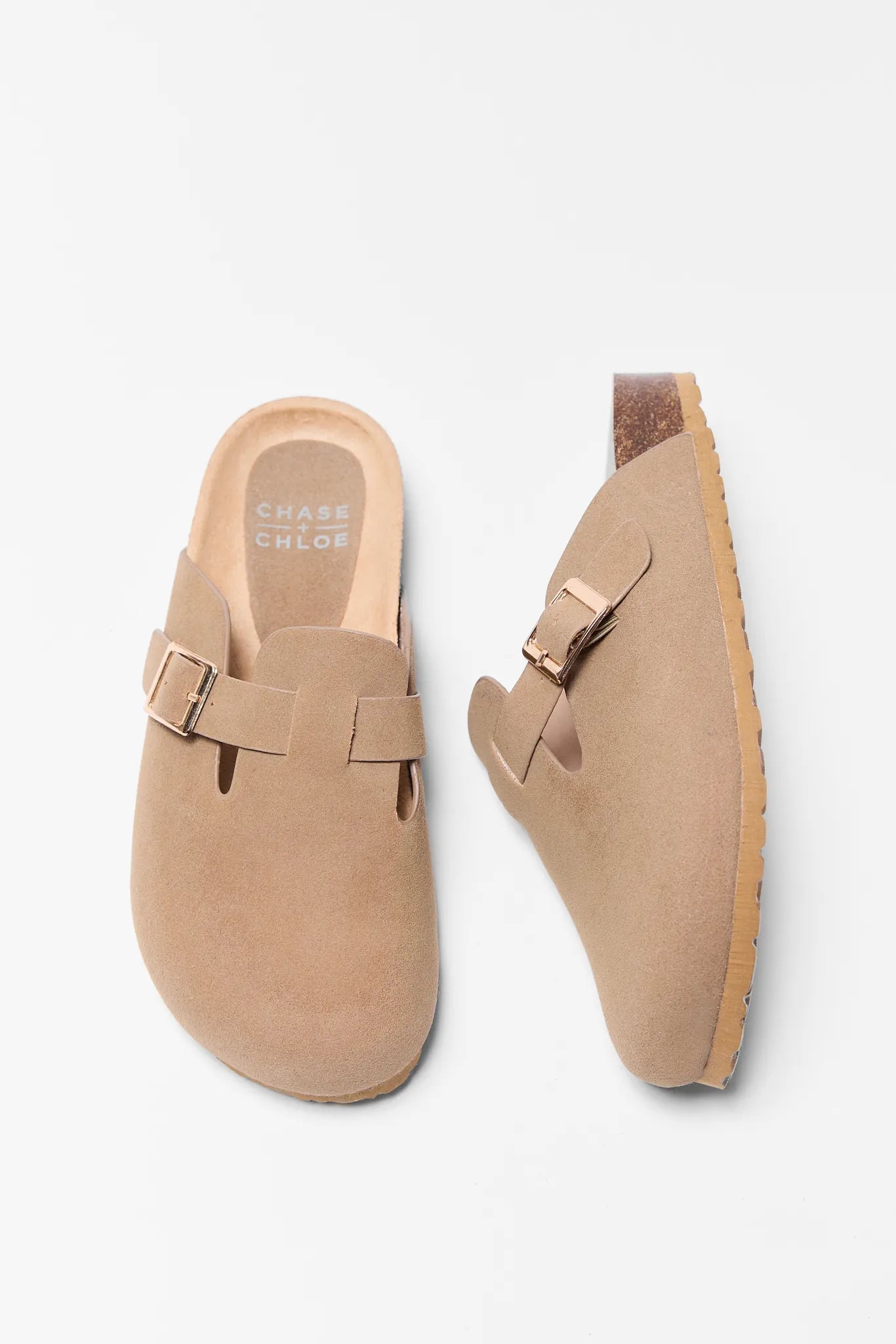 Pair of tan loafers with a buckle on a white background Amelia Tan Faux Suede Mules