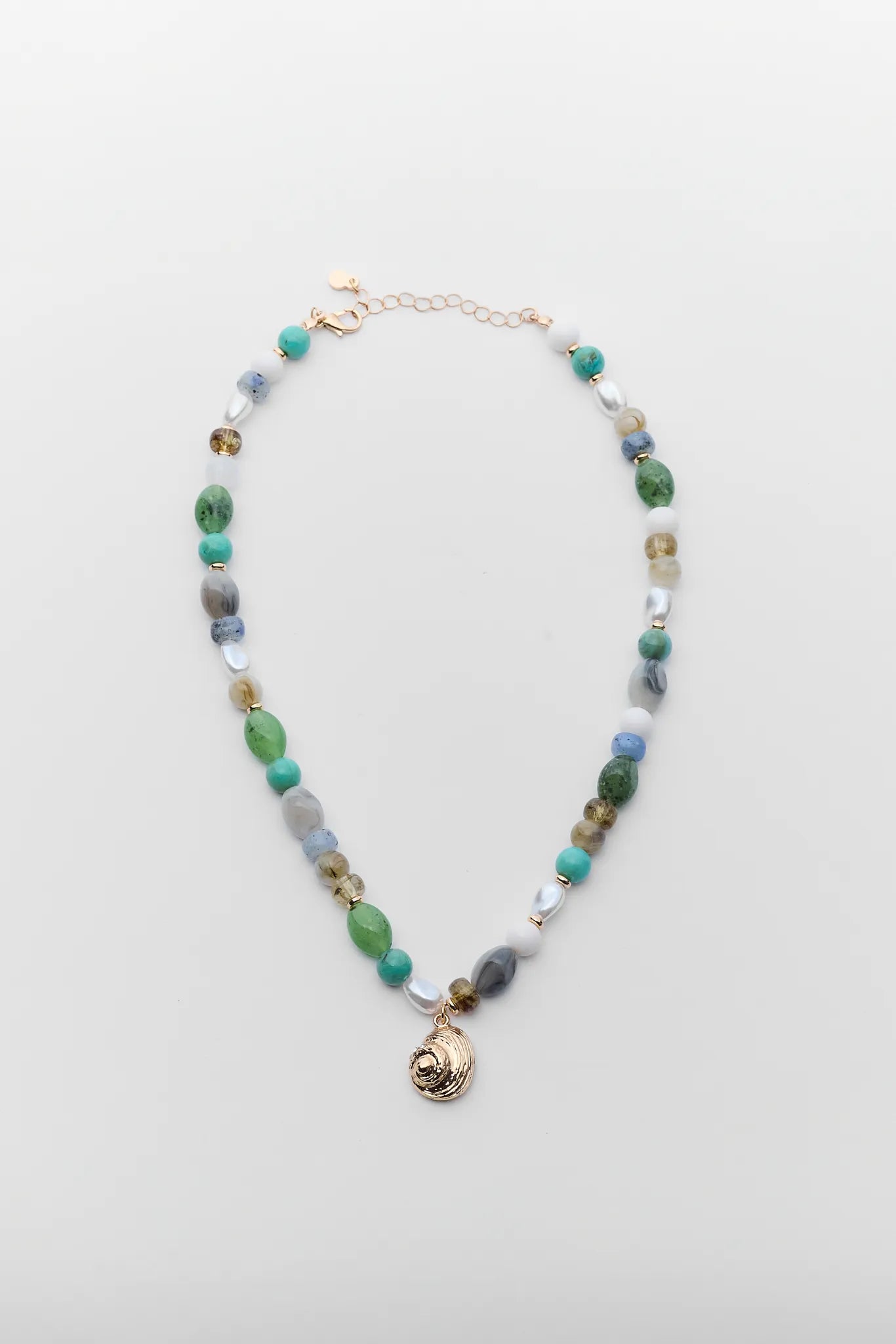 Necklace with multicolored beads on a light gray background