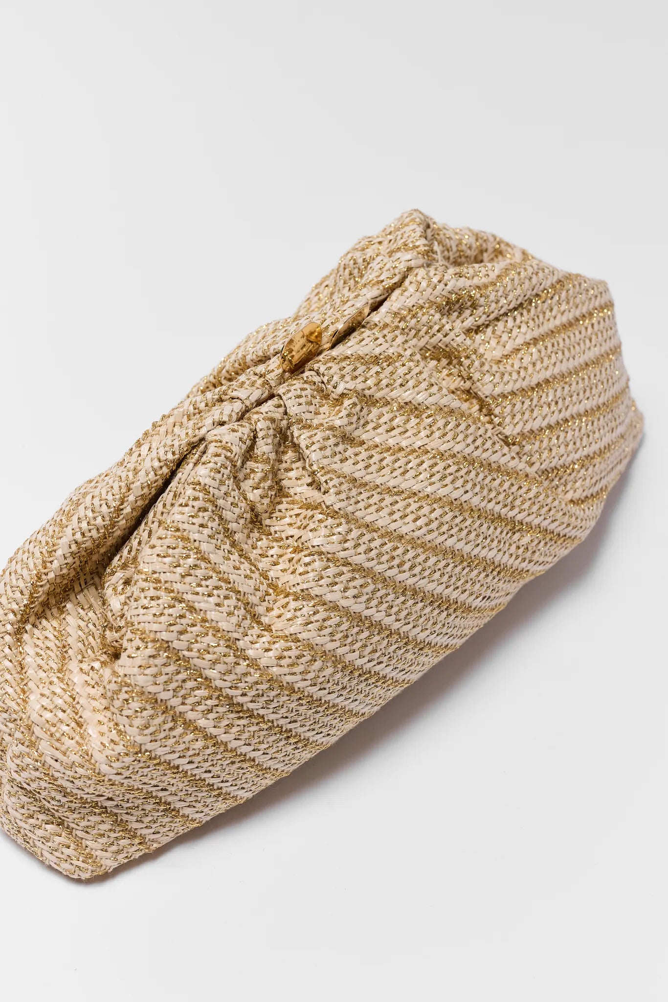 Beige knitted headband on a light gray background