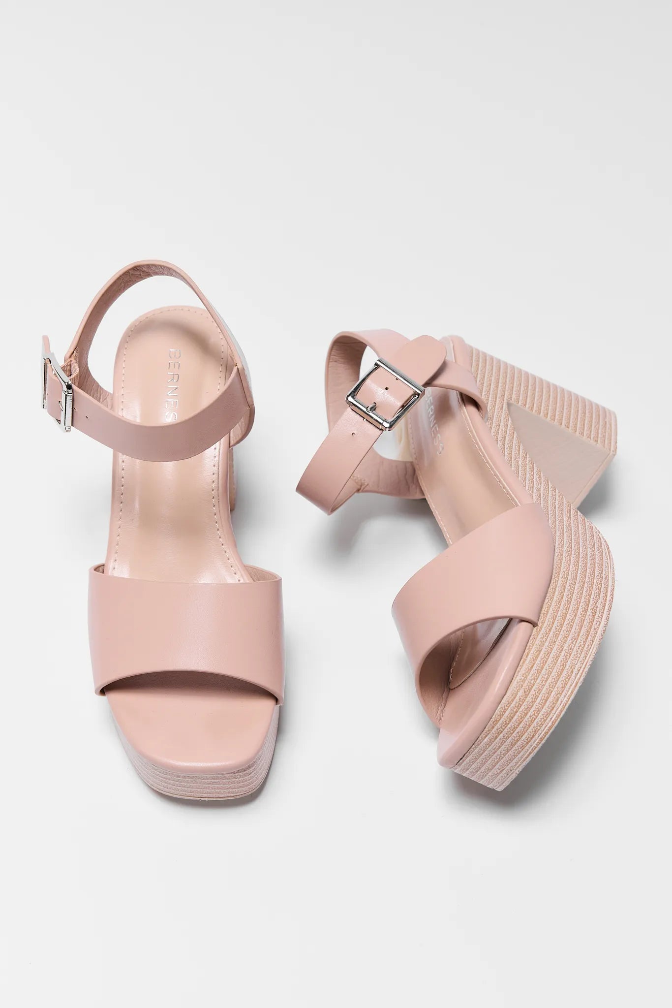 Pair of Bethany Nude Platform Heels on a light gray background