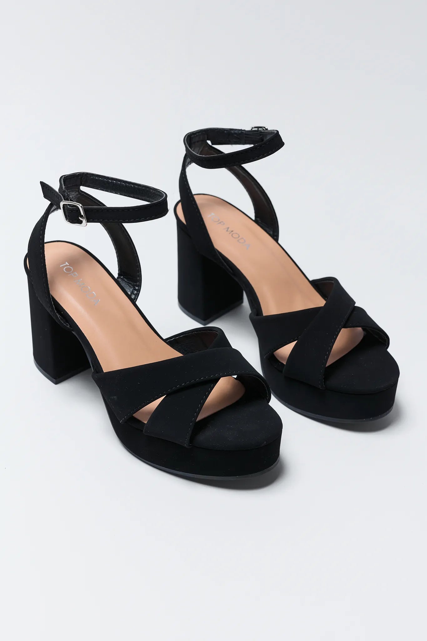 Beverly Black Platform Heels on a light gray background