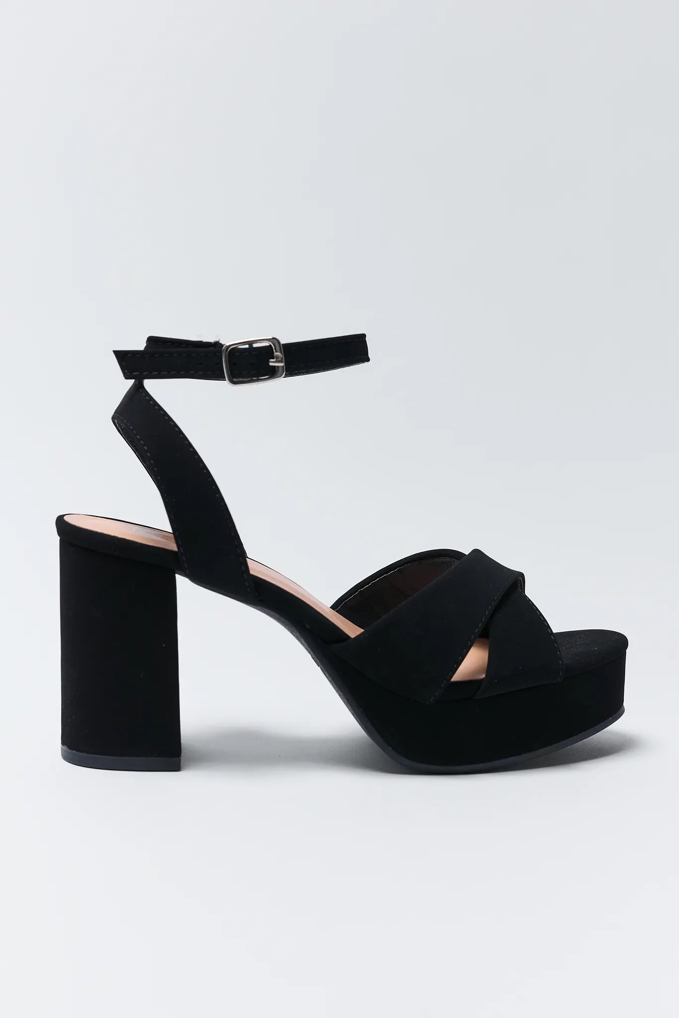 Beverly Black Platform Heels on a light gray background