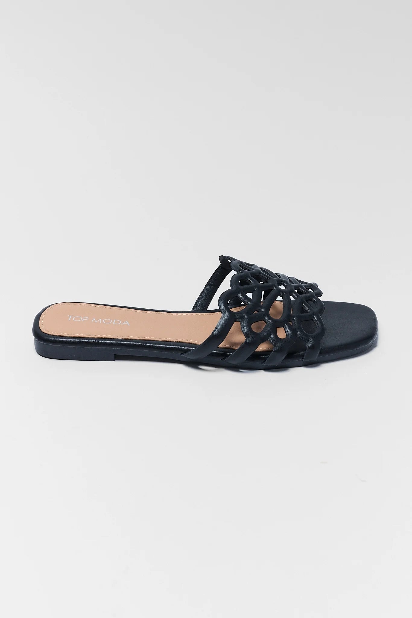Black sandal with open-toe design on a white background