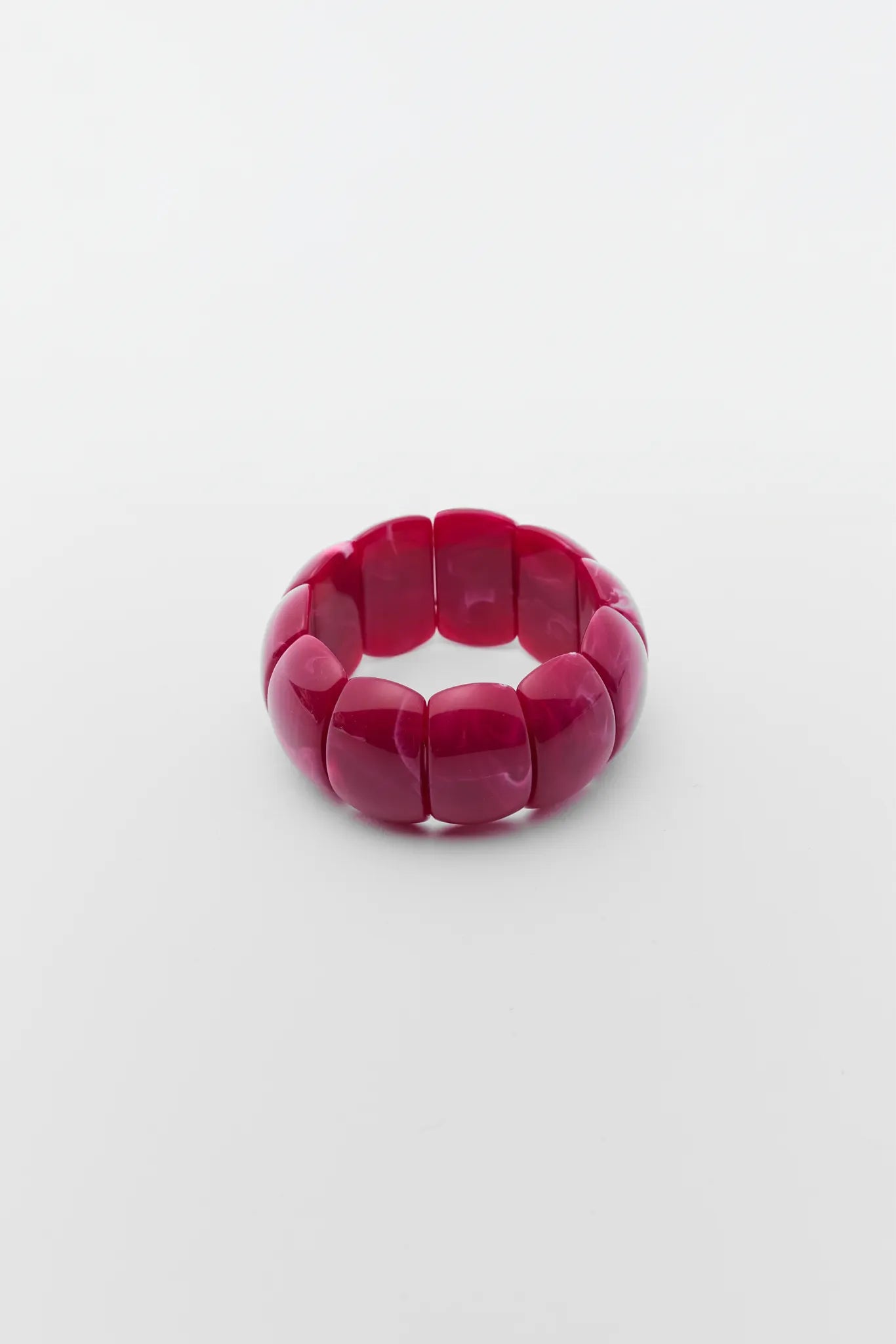 Pink stretch ring on a white background