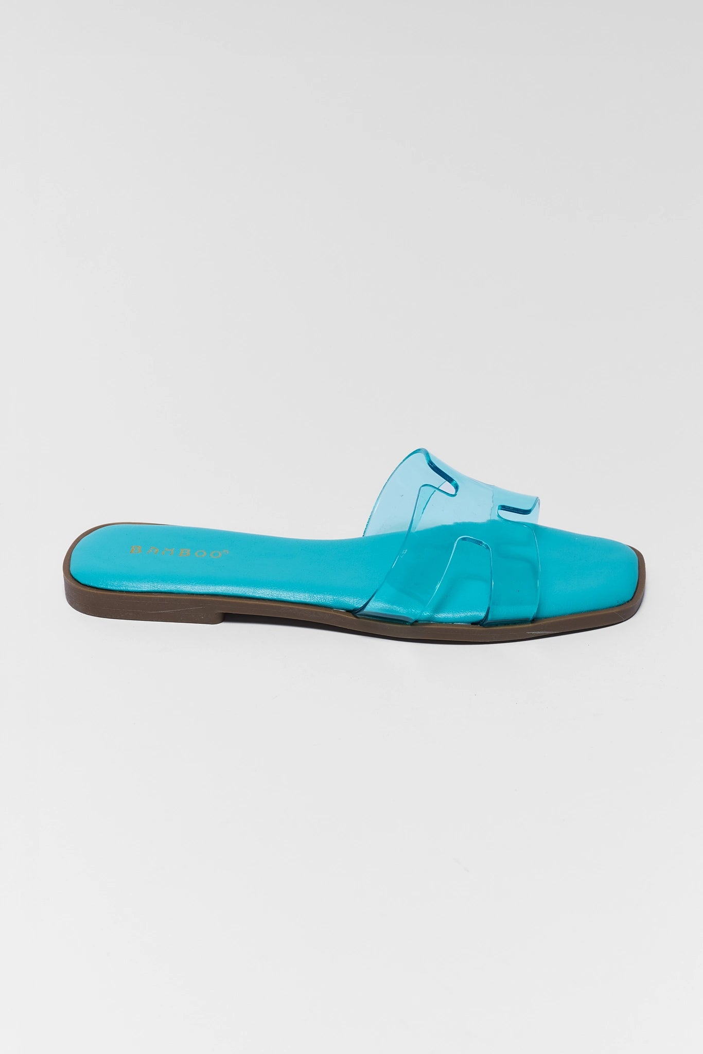 one Turquoise sandal with a strap on a light gray background