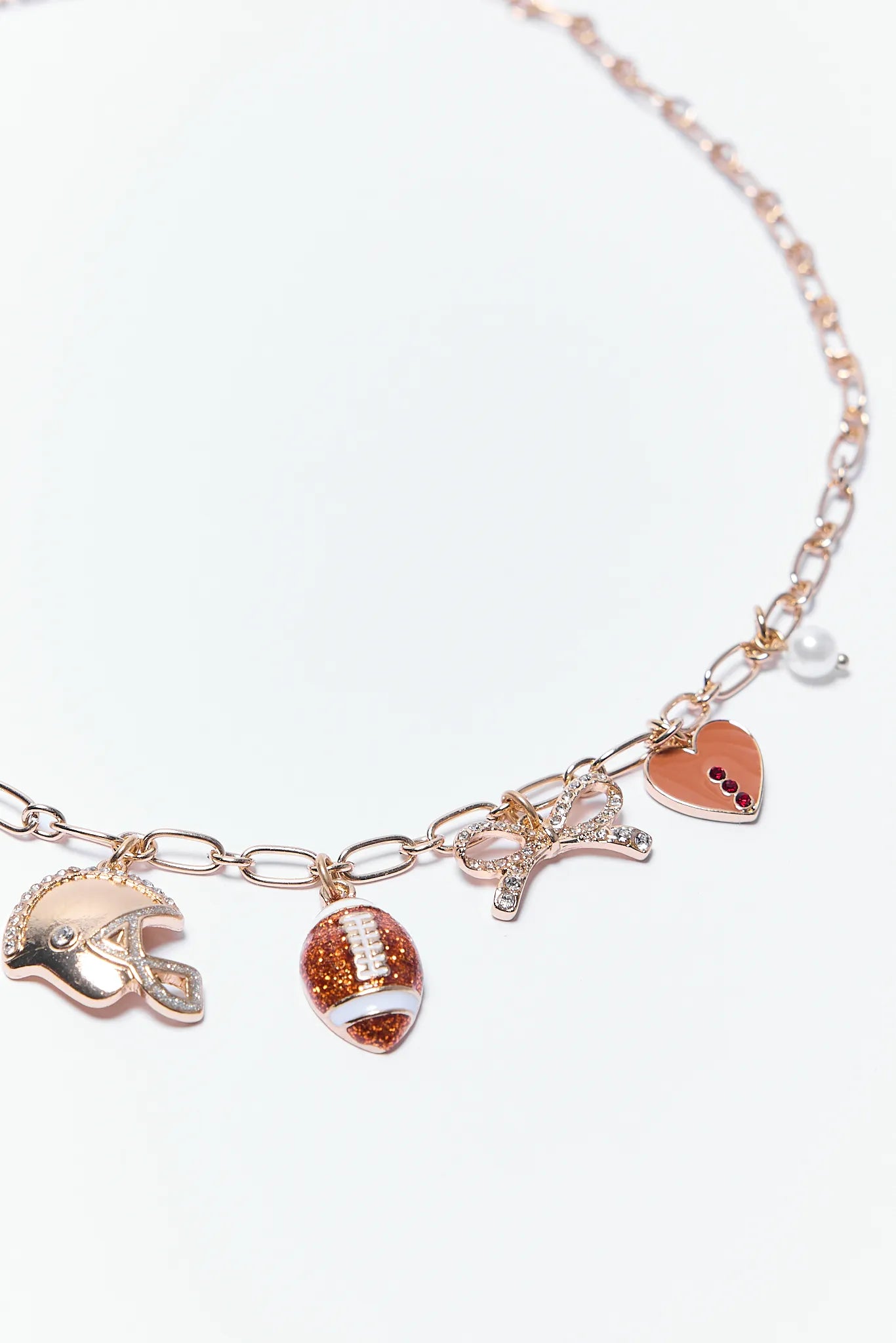Brady Necklace with various charms including a football helmet, football, and heart on a white background