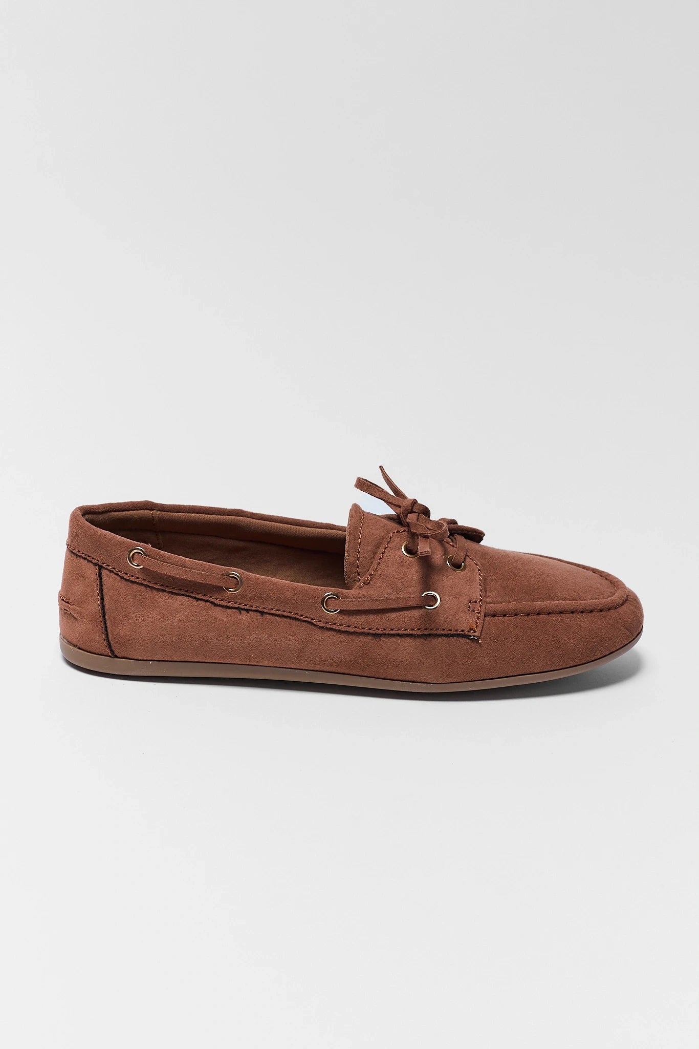 one Brown suede loafer shoe on a light gray background