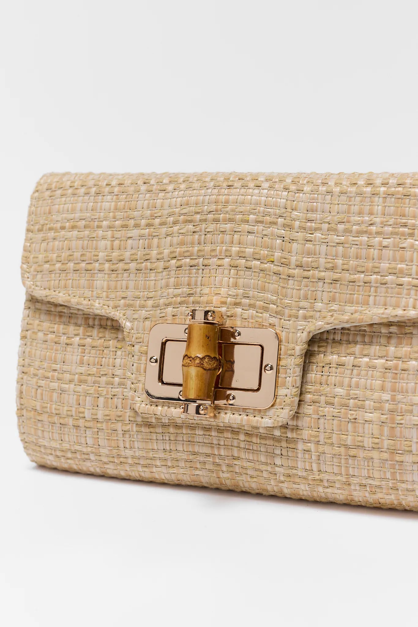 Beige woven handbag with a gold clasp on a white background