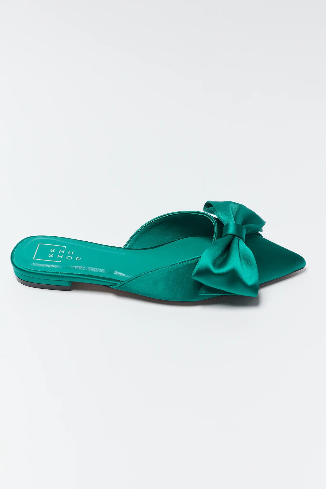 Teal Dottie Pointed Toe Bow Flats on a light gray background