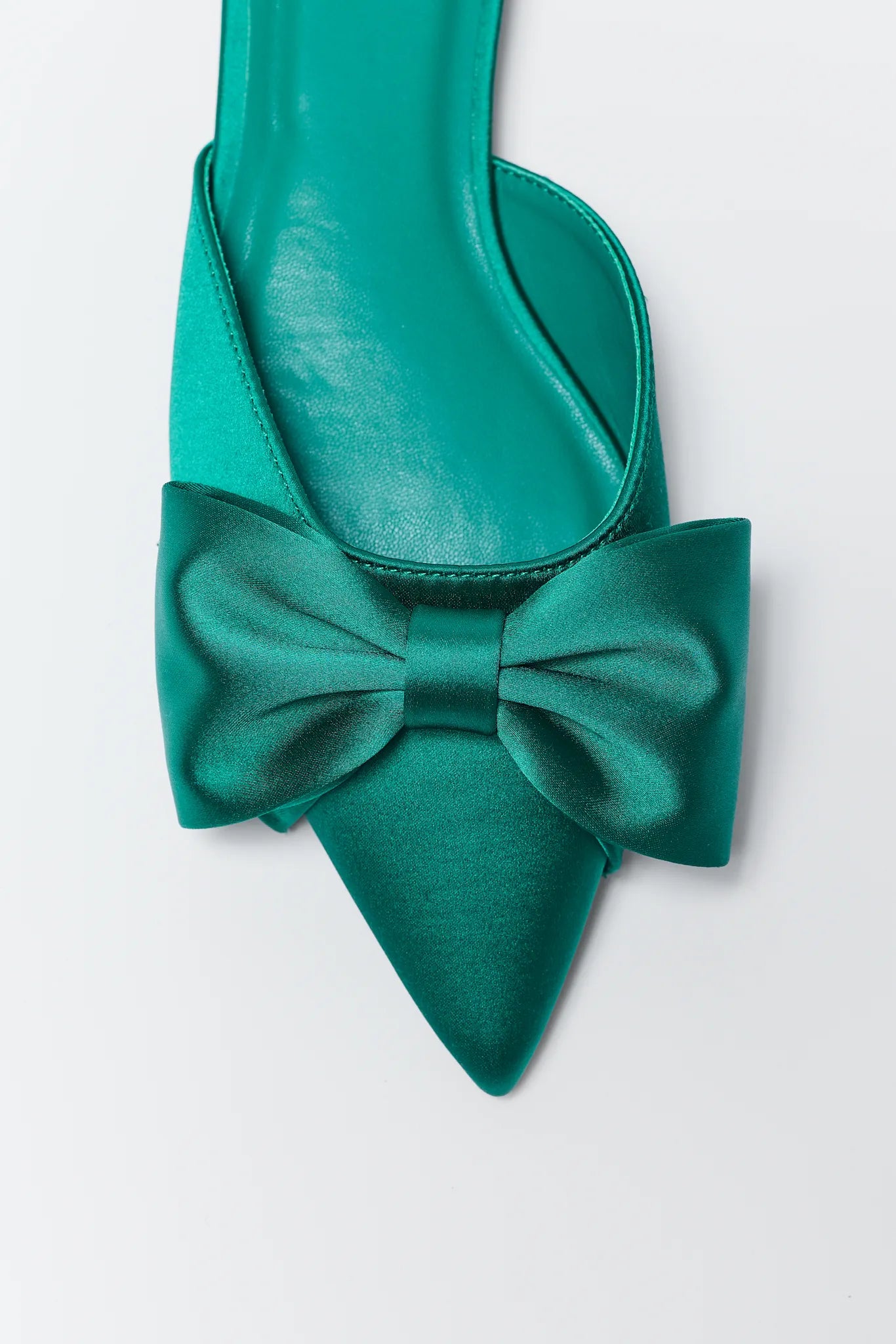 Teal Dottie Pointed Toe Bow Flats on a light gray background