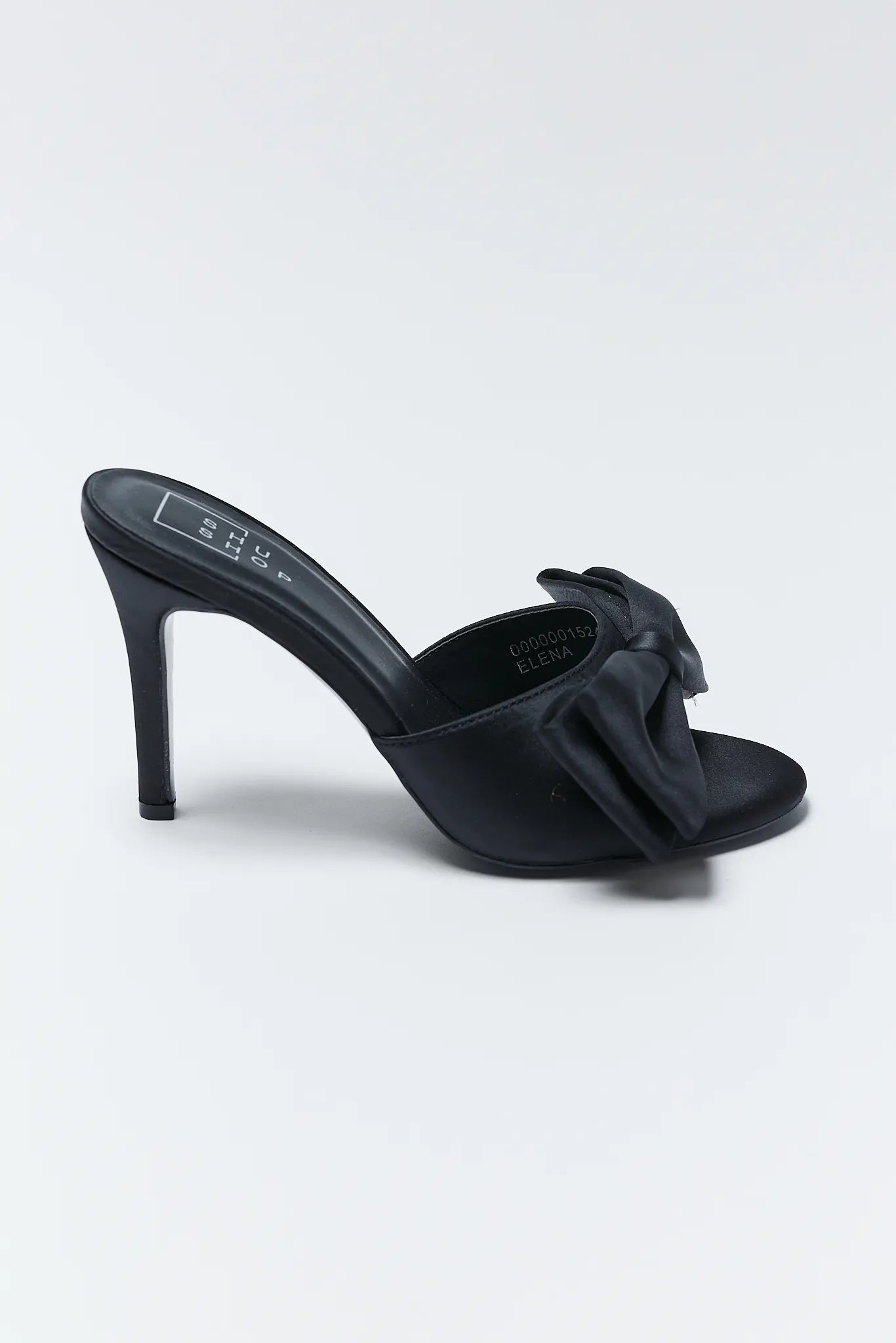 Elena Black Bow Heels with bow details on a light gray background