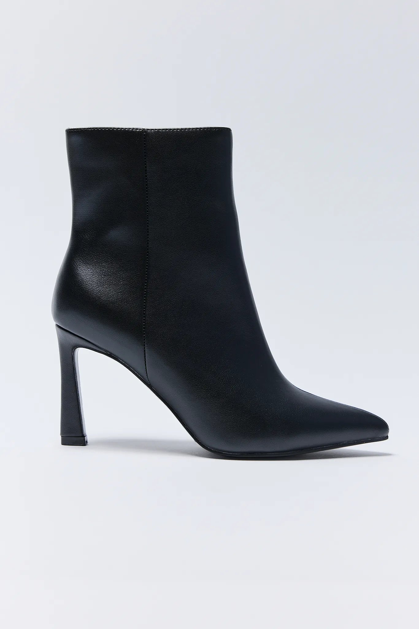 Black ankle Emery Boots with a high heel on a white background