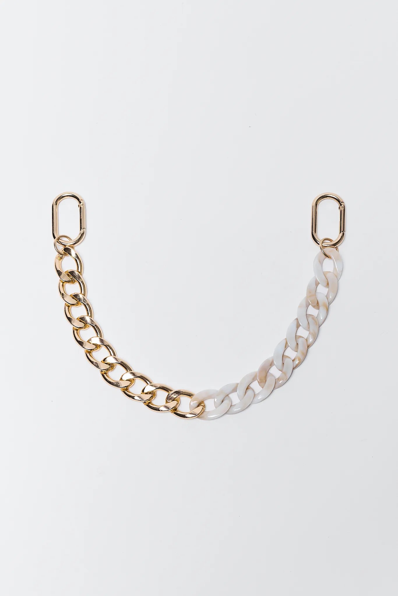 Eva Ivory Bag Charm accessory on a light gray background