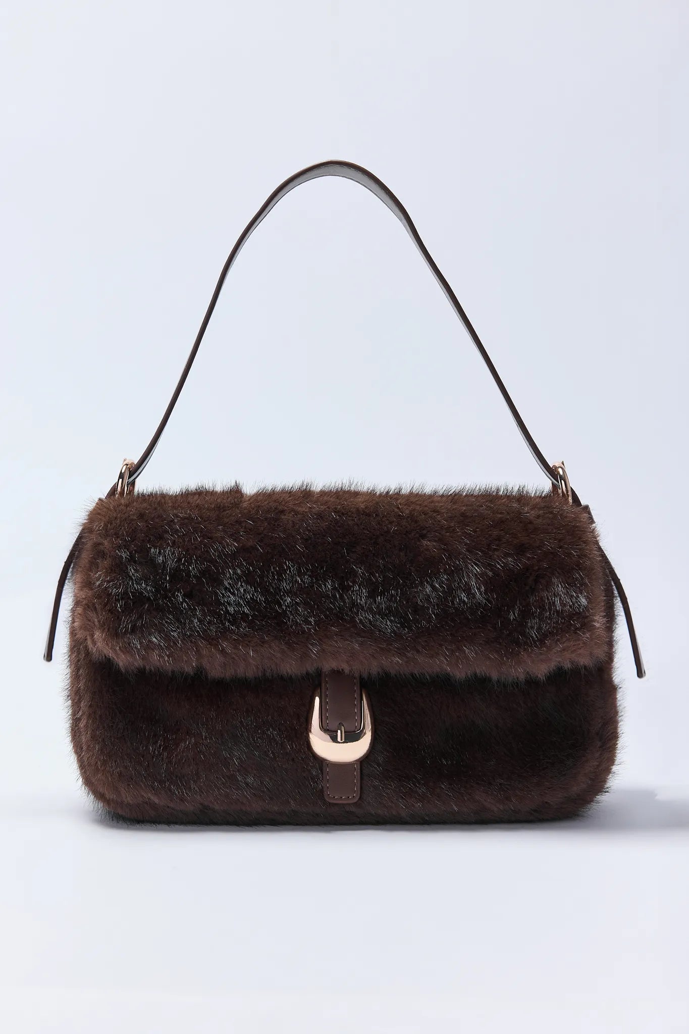 Brown fur Gloria Bag with a gold clasp on a light gray background