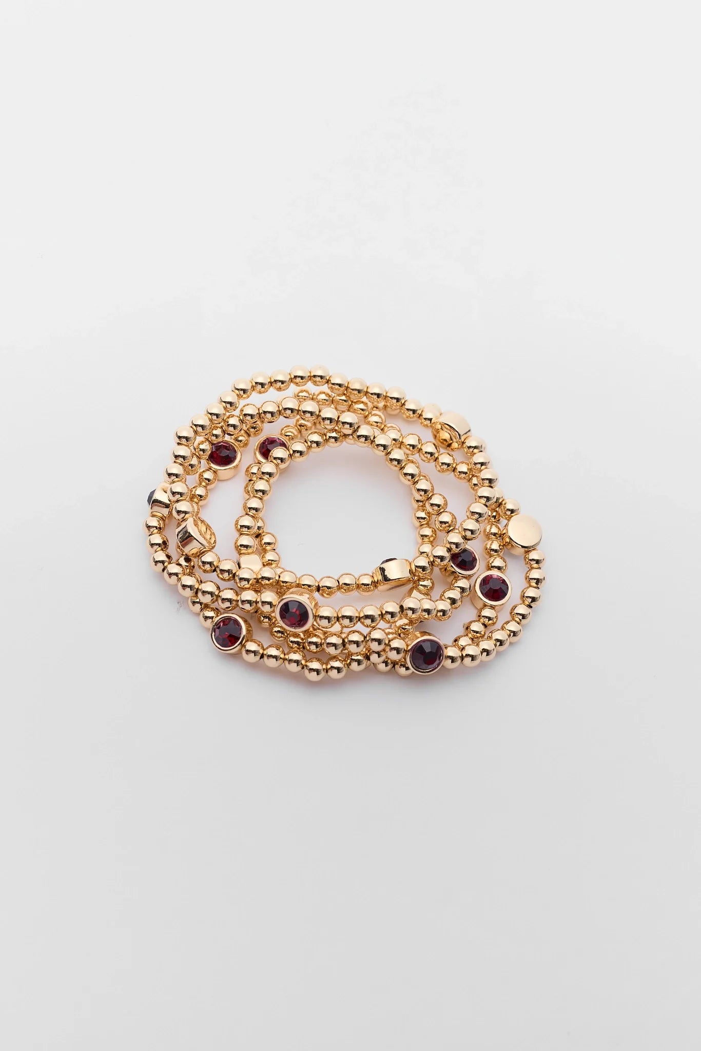 Gold Beaded Maroon Rhinestone Bracelet on a white background