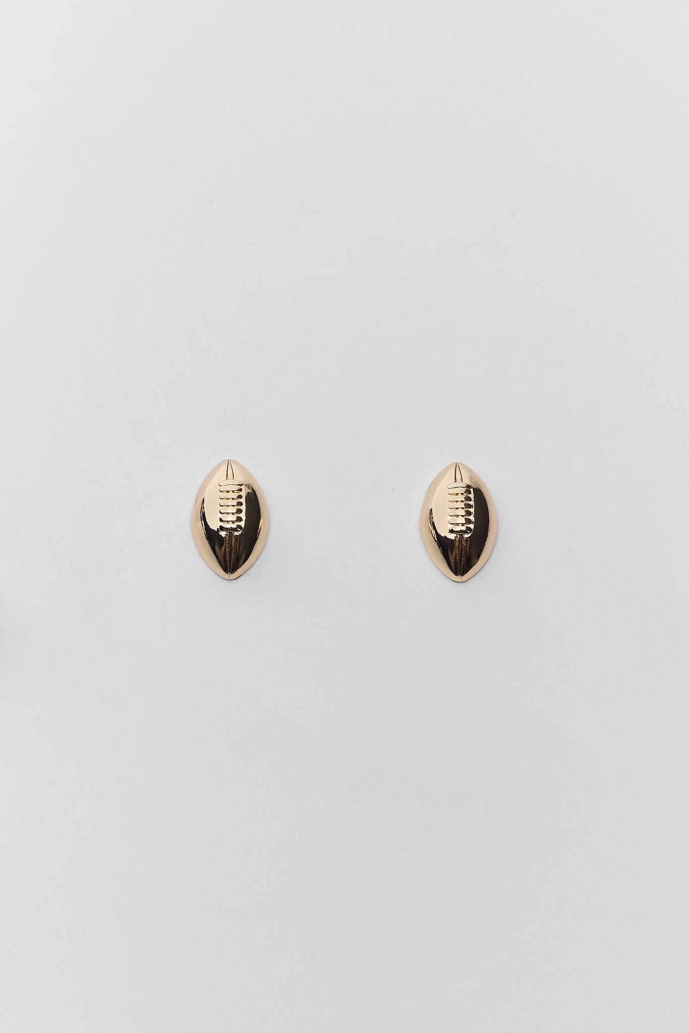 Gold Football Stud Earrings on white background