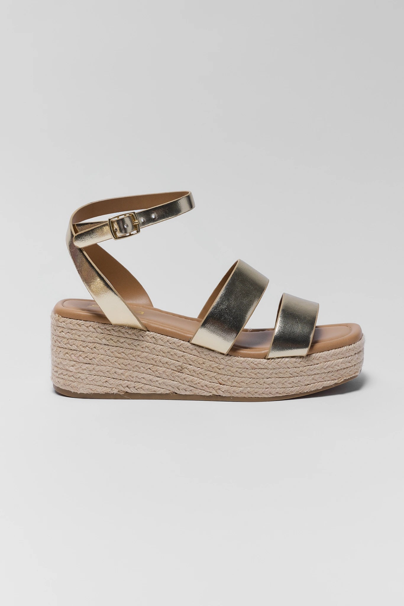 one Gold wedge sandal with jute sole on a light gray background