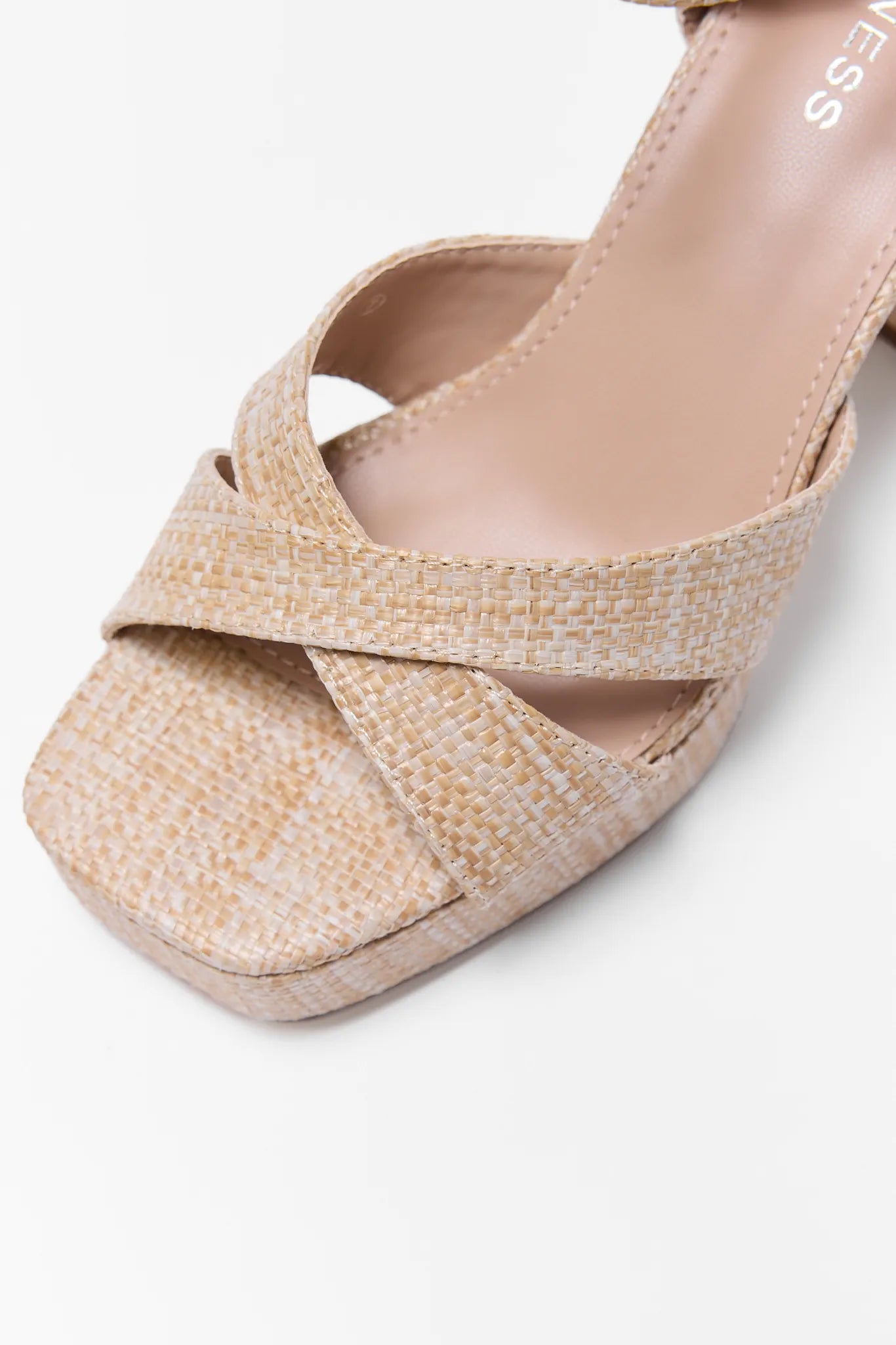 Beige woven sandal on a white background