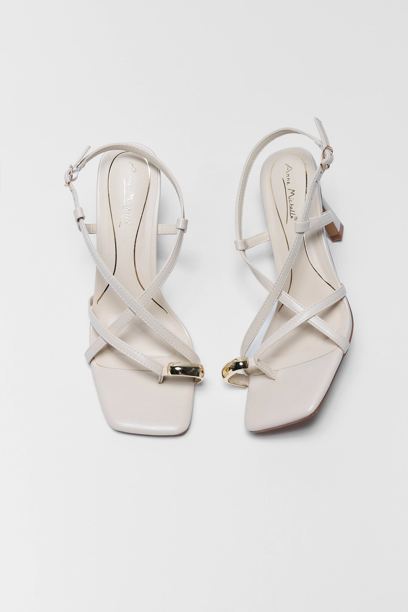 Judith Ivory Faux Leather Strap Heels on white background