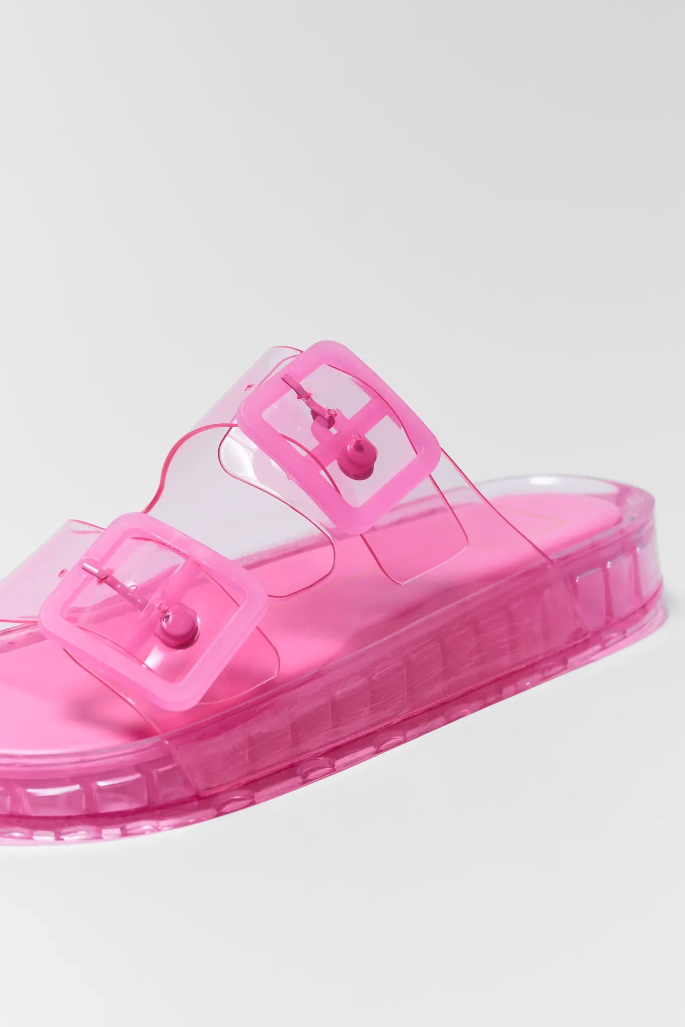 Pink jelly sandal on a light gray background