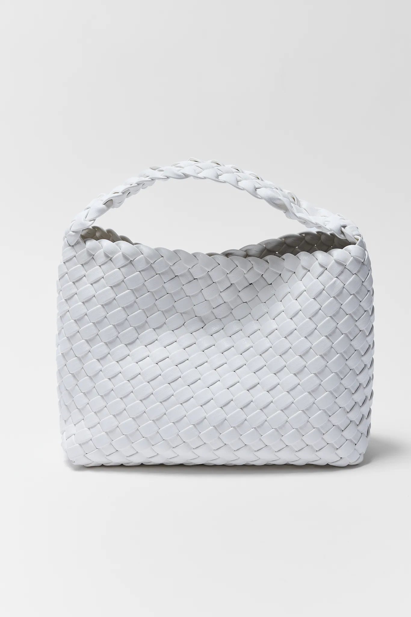 Woven handbag on a light gray background