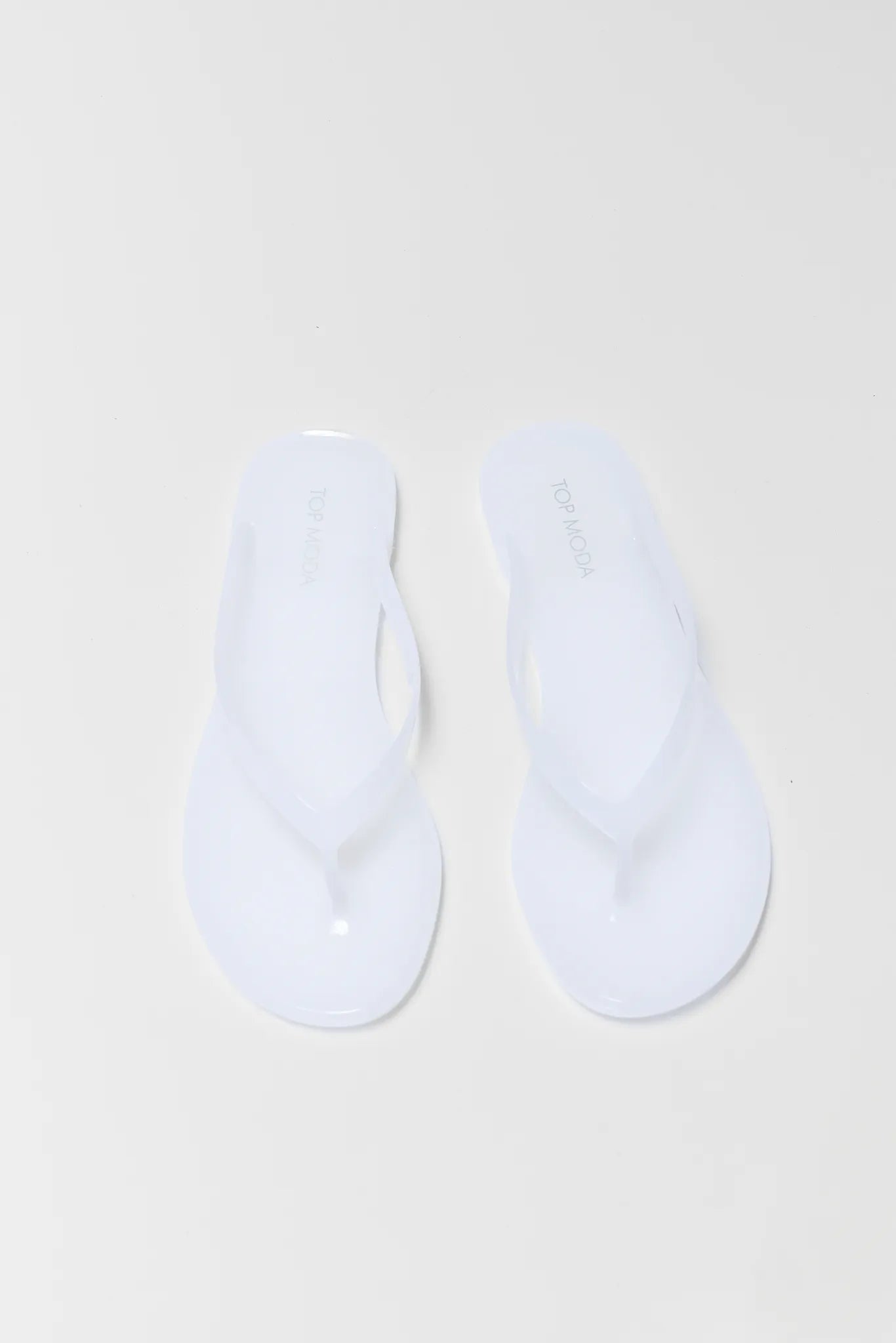 Two white socks on a beige background