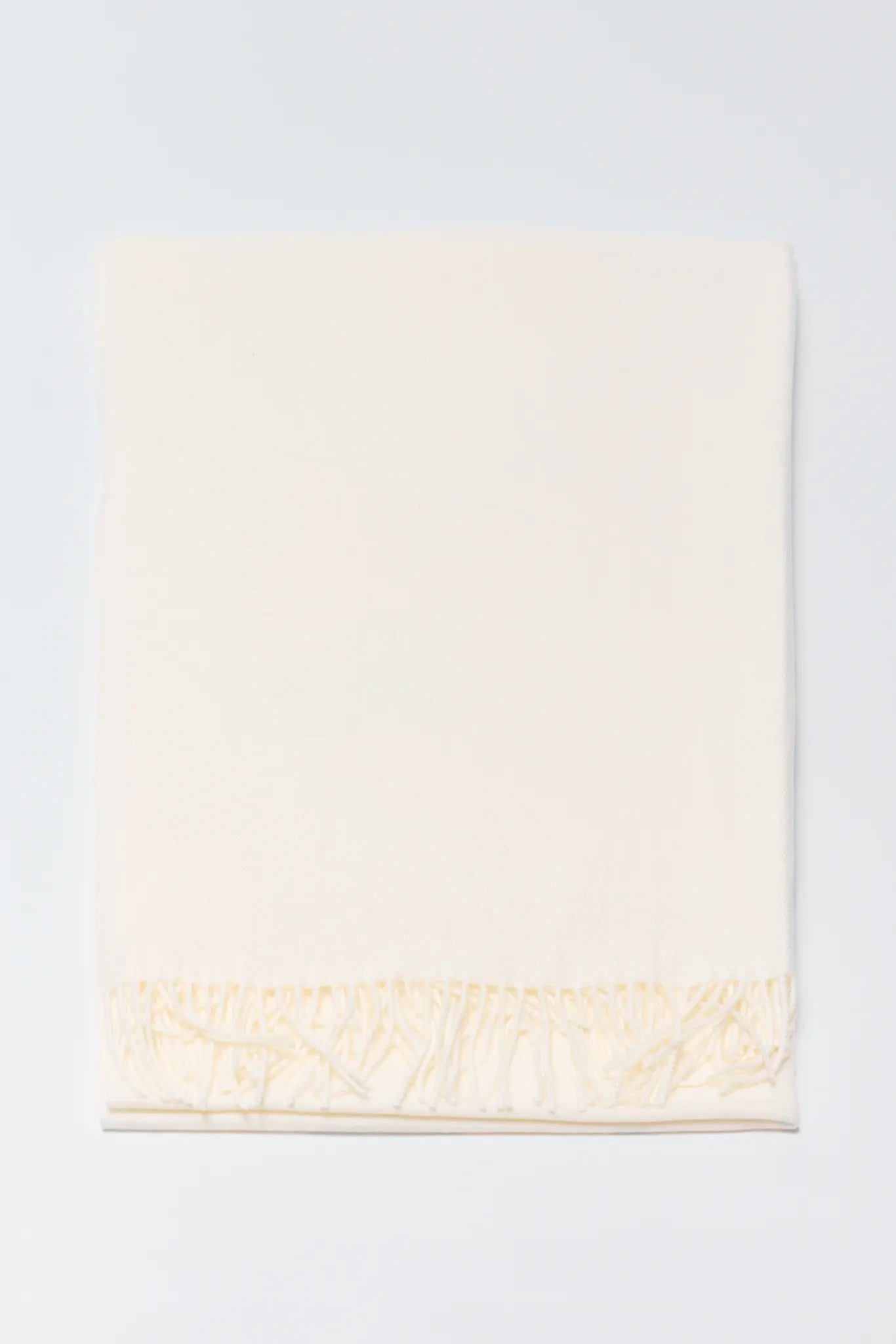 Beige towel on a light gray background