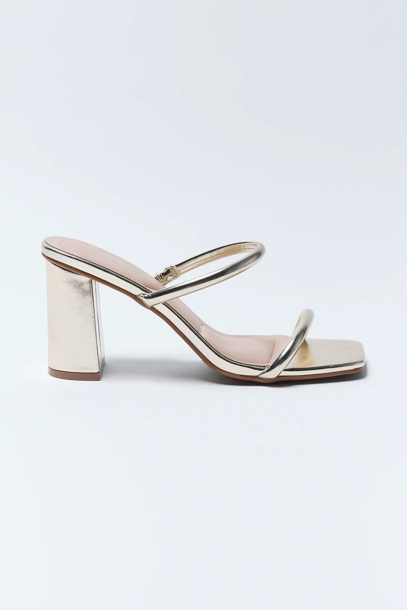 Pair of Kayce Gold Block Heels with metallic accents on a light background