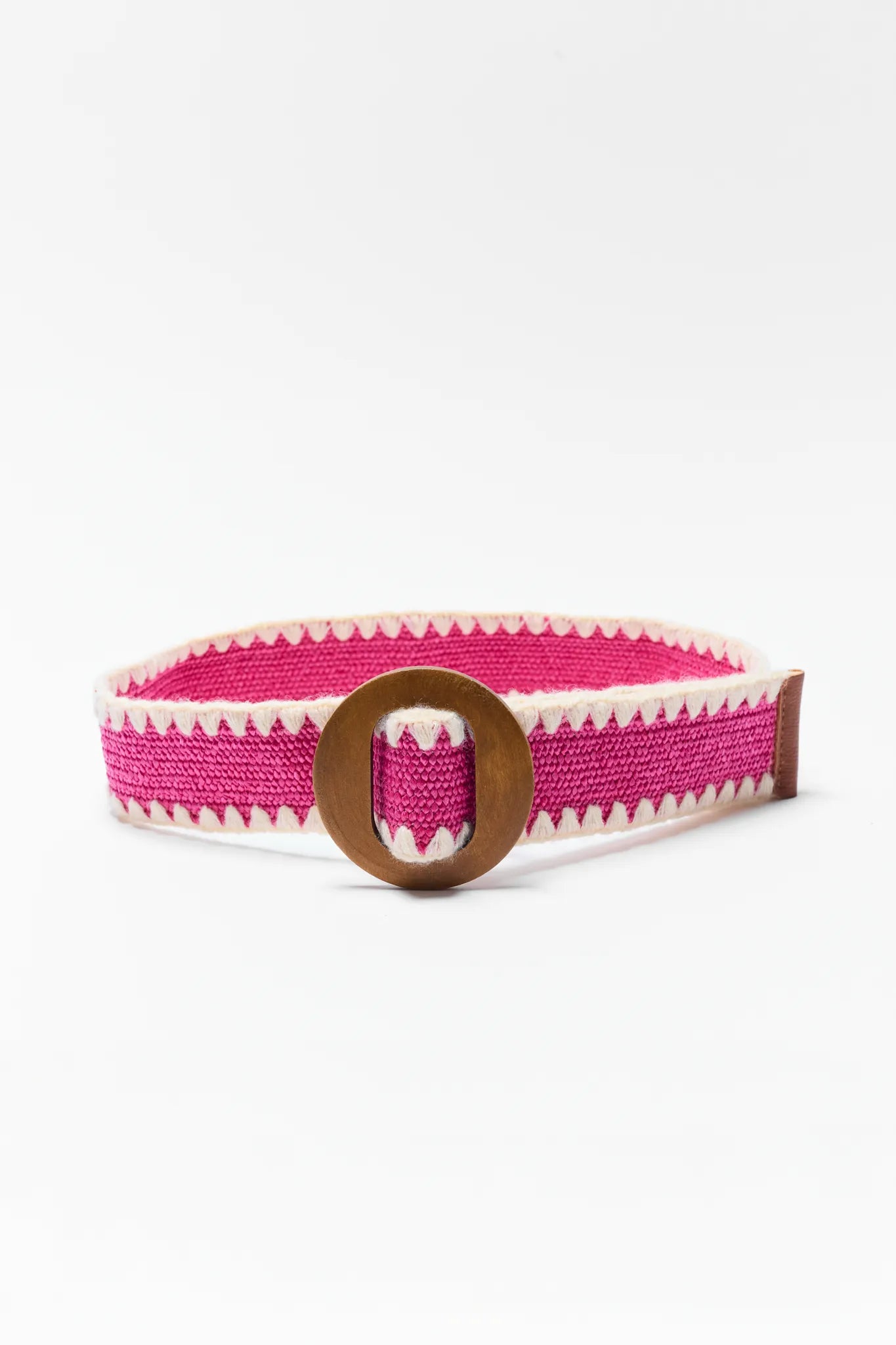 Pink and white woven belt with a wooden buckle on a white background