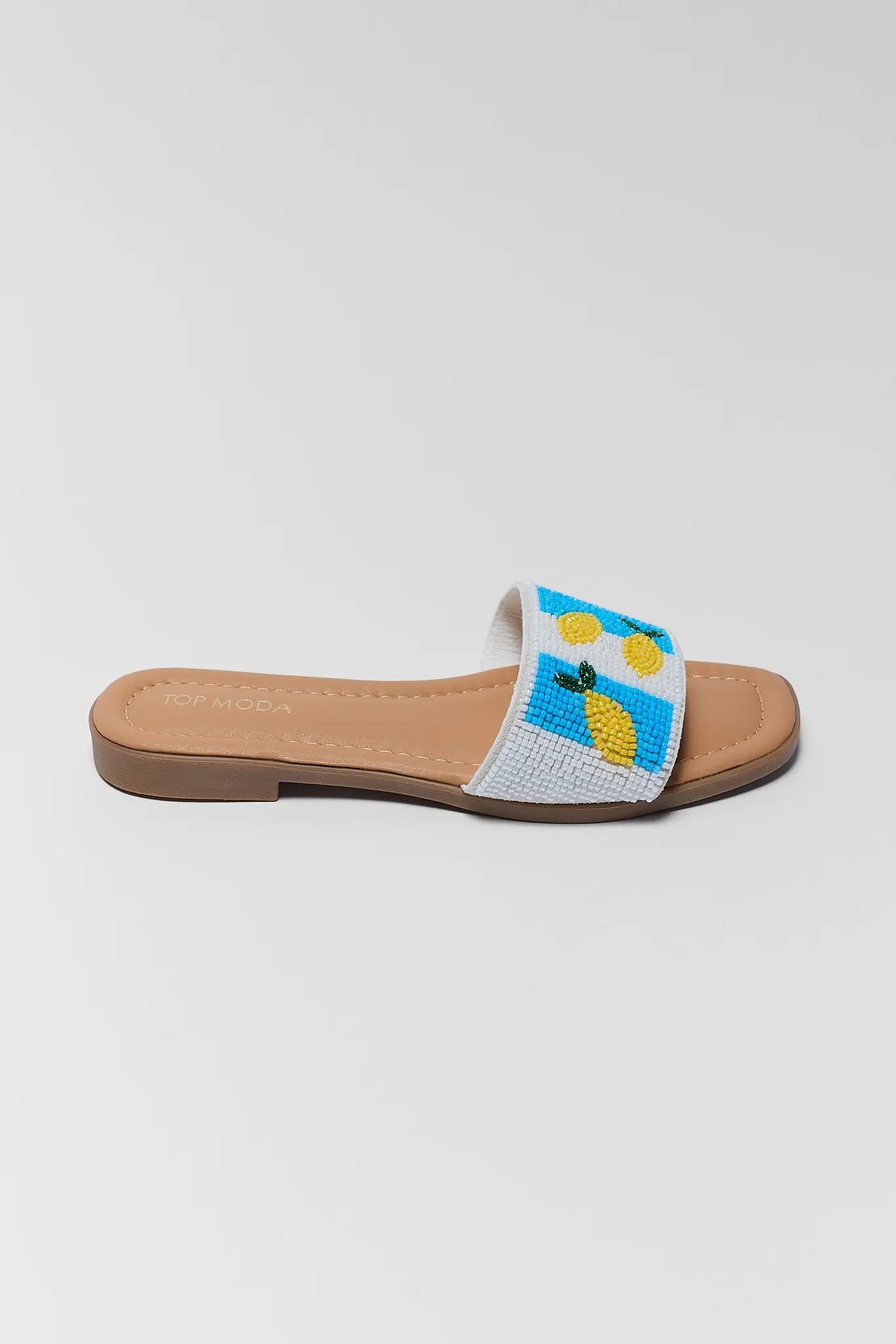 Beaded sandal with pineapple design on a white background one