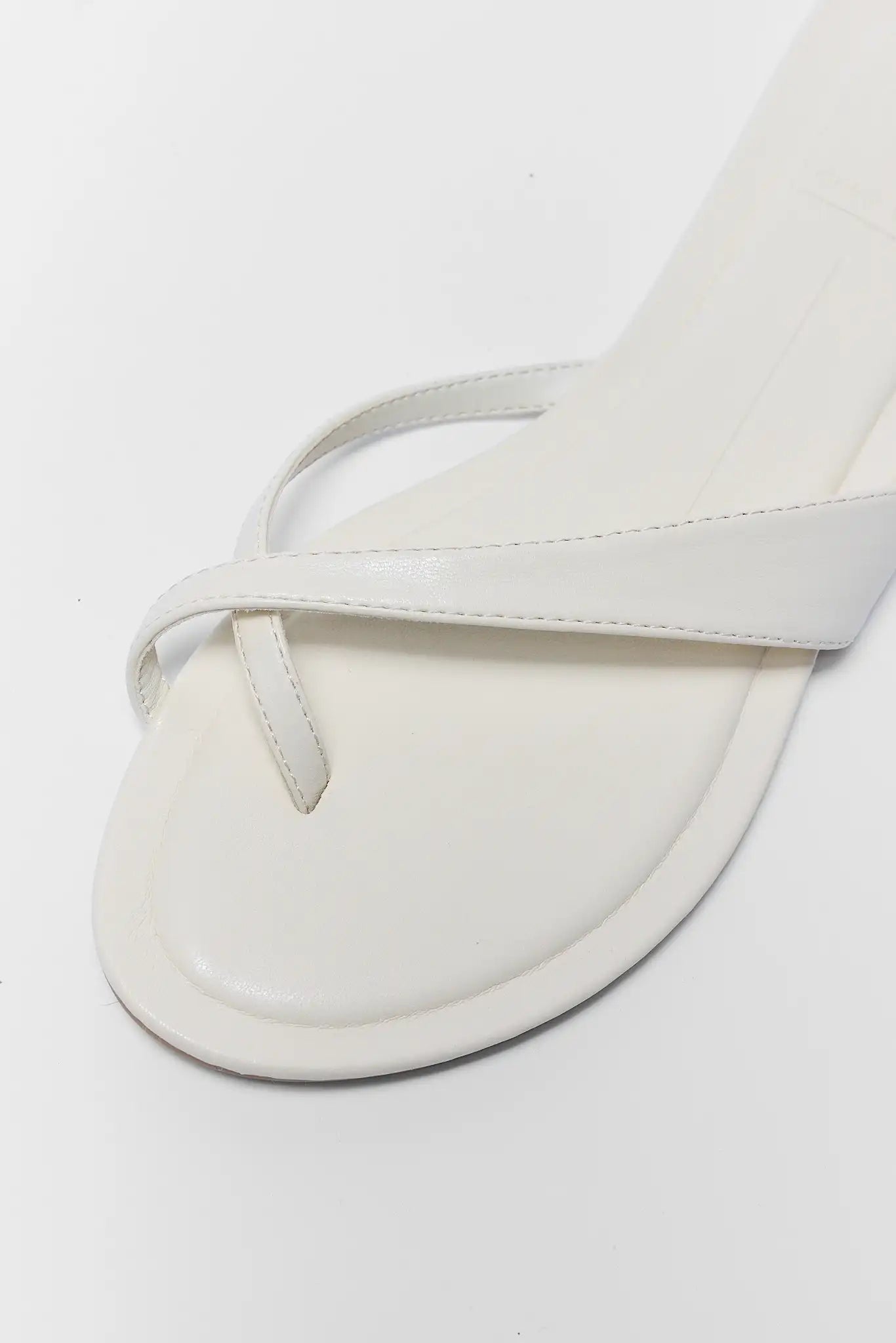 White sandal on a light gray background close up
