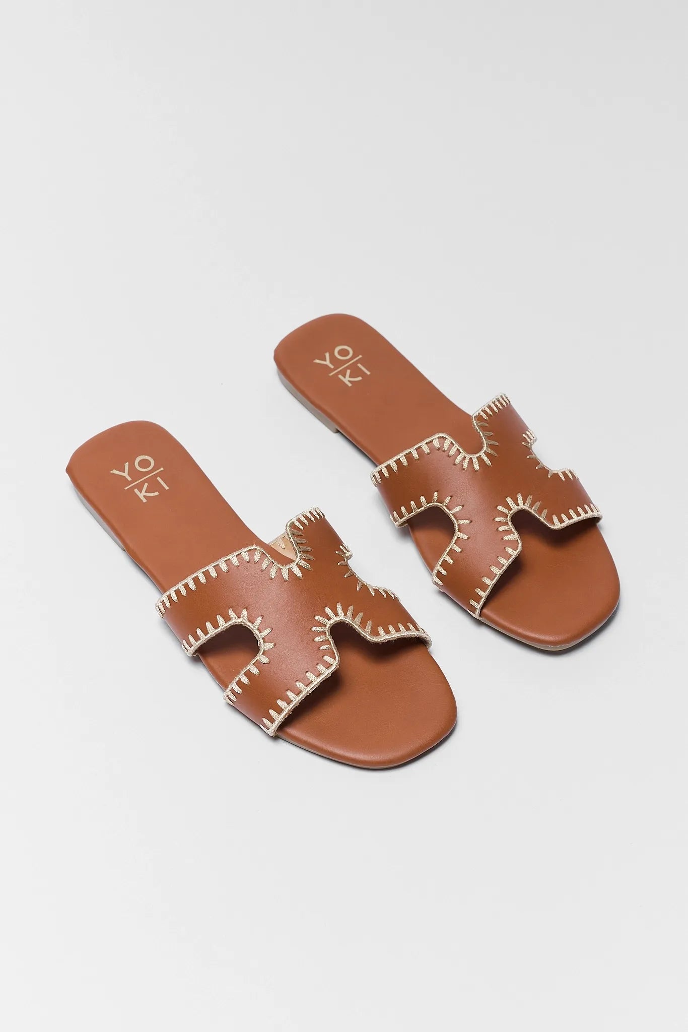 two Leslie Camel Faux Leather Sandals on white background