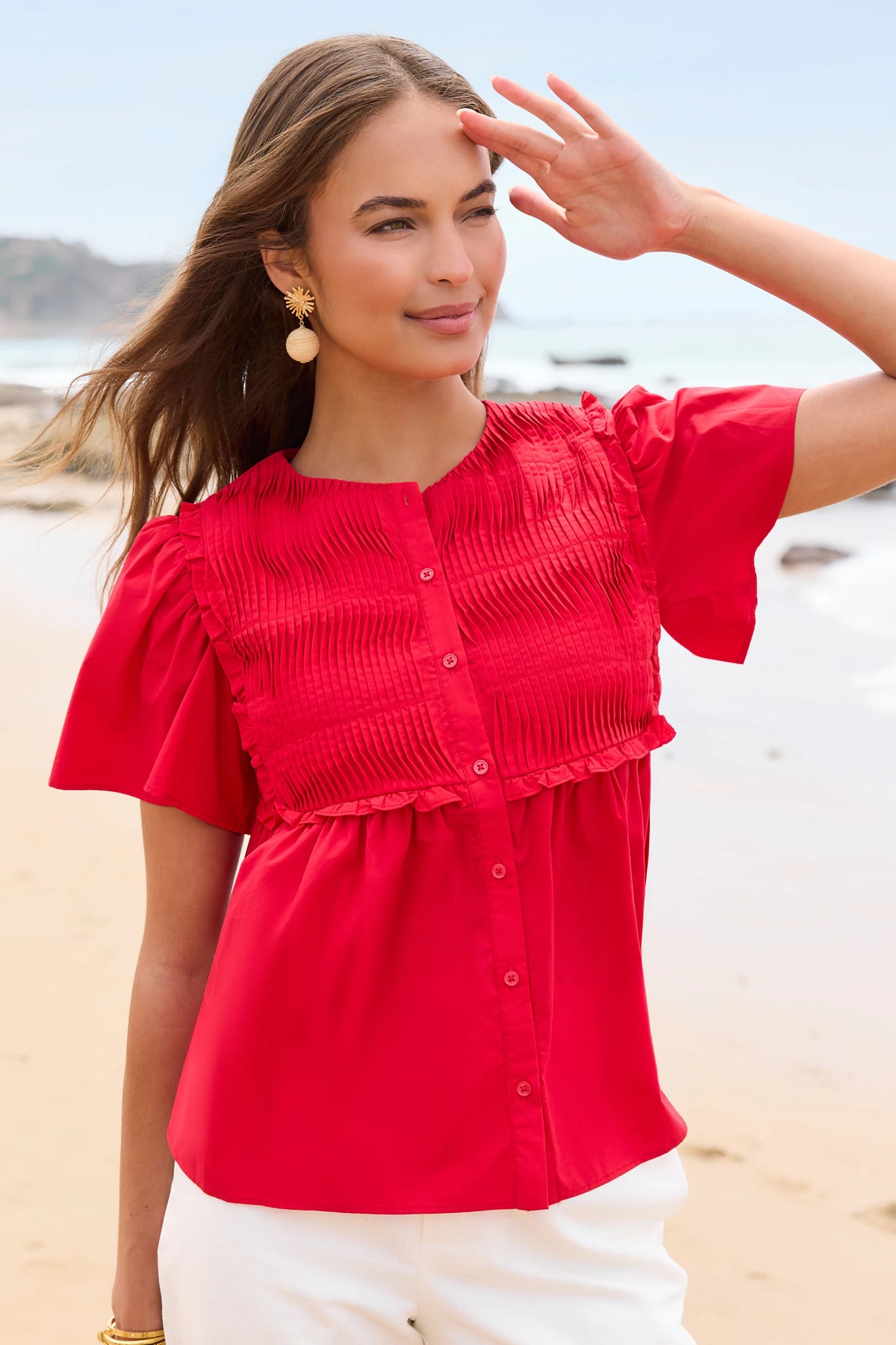 Woman in a red blouse on a beach lifestyle
