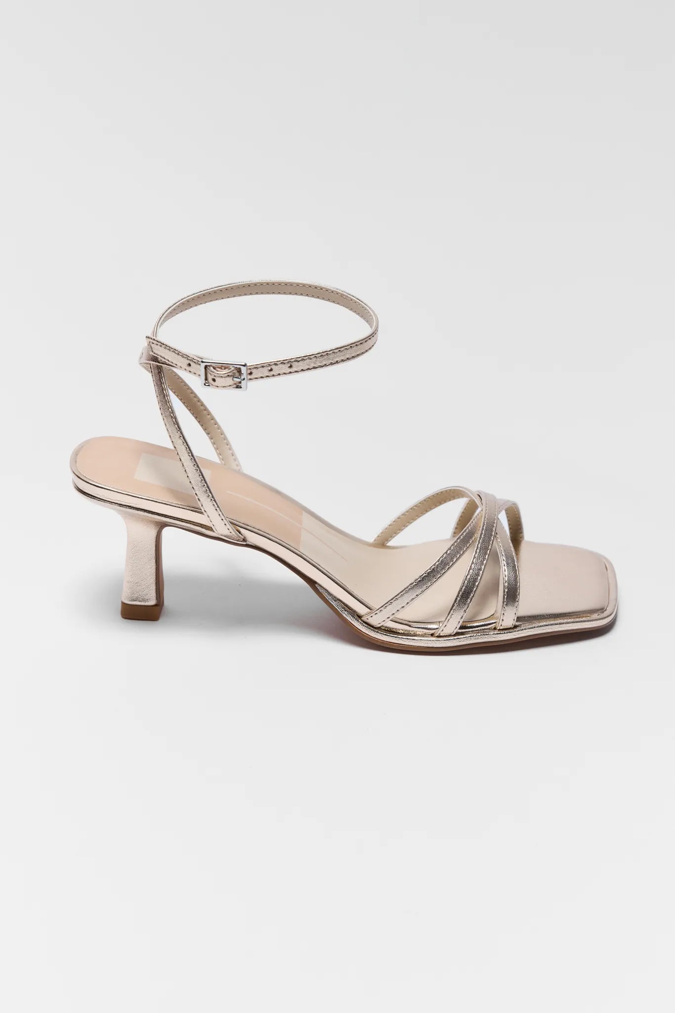 Silver high-heeled sandal on a white background