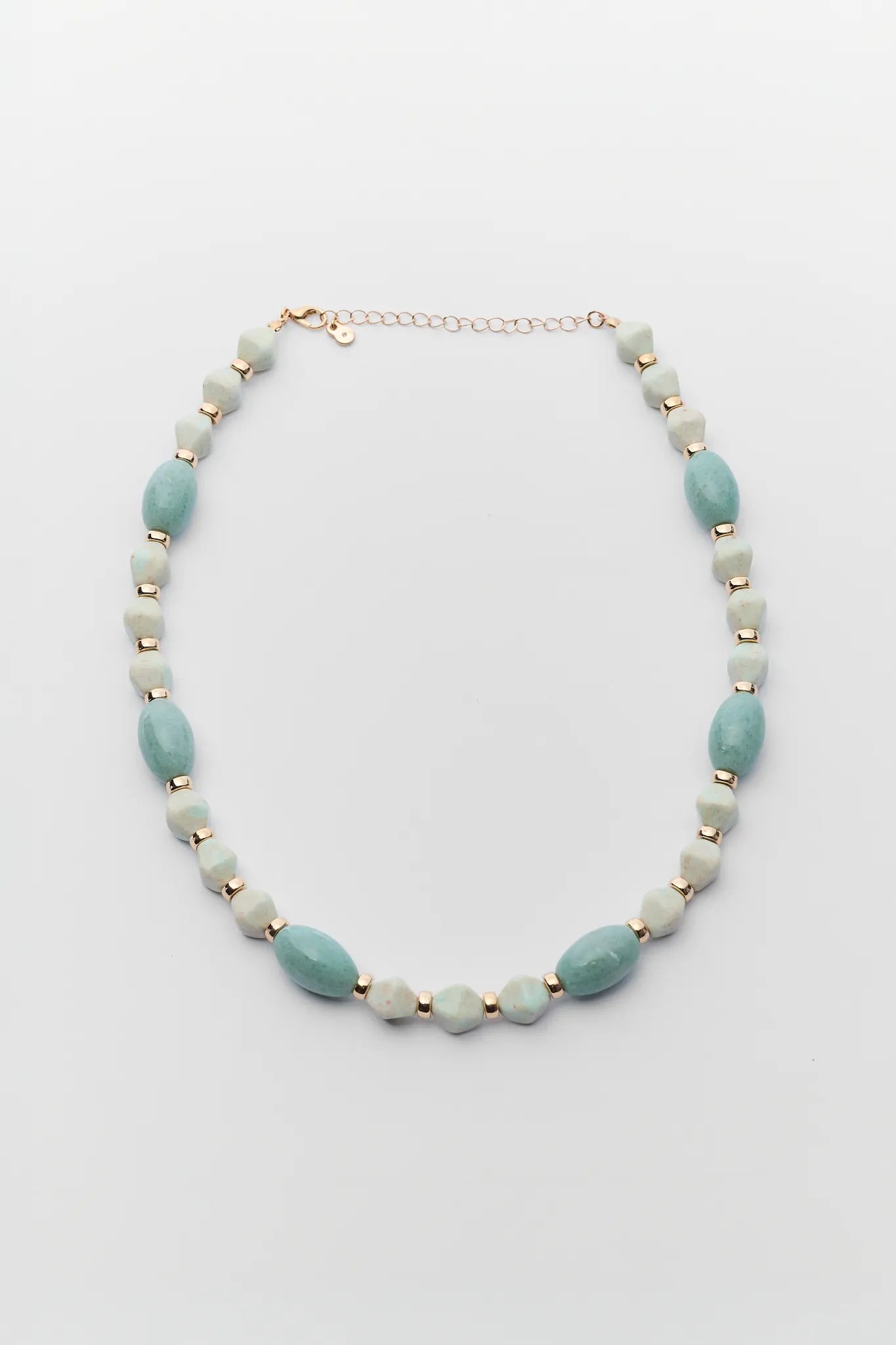 Necklace with light blue and beige beads on a white background