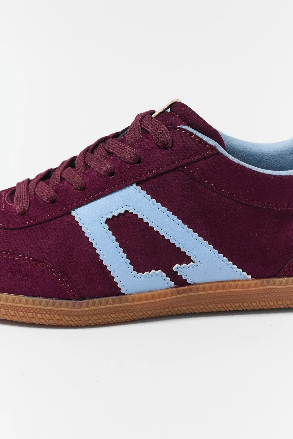 Maroon Faux Suede Sneakers - Close-Up Logo & Sole Detail | Avara