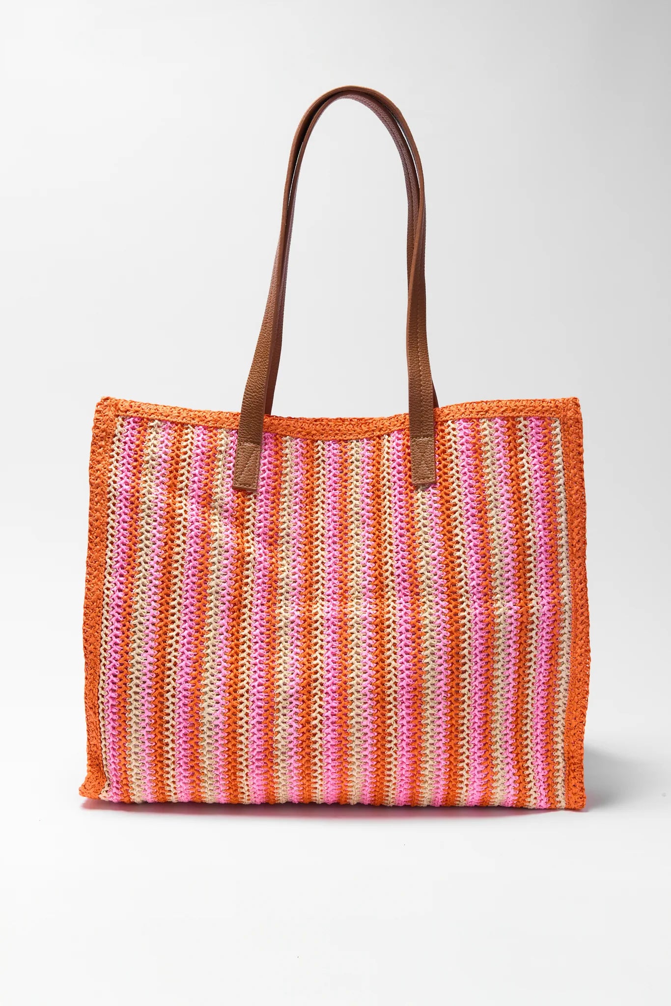 Striped woven bag with brown handles on a white background