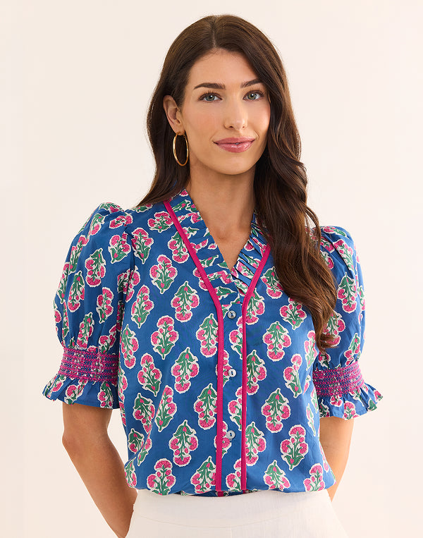lifestyle navy top on woman with white background
