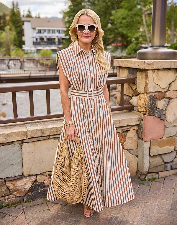 woman wearing brown and white striped dress outdoors
