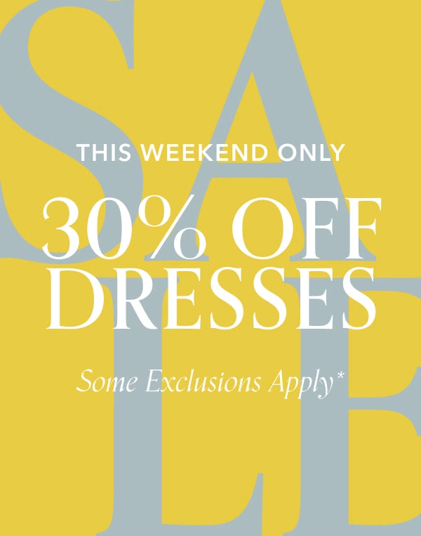 Promotional sign with '30% off dresses' sale text on a yellow background navigation
