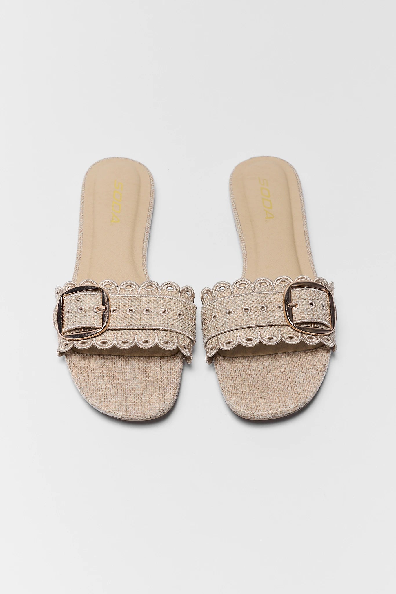 two Nancy Tan Scalloped Buckle Sandals on white background