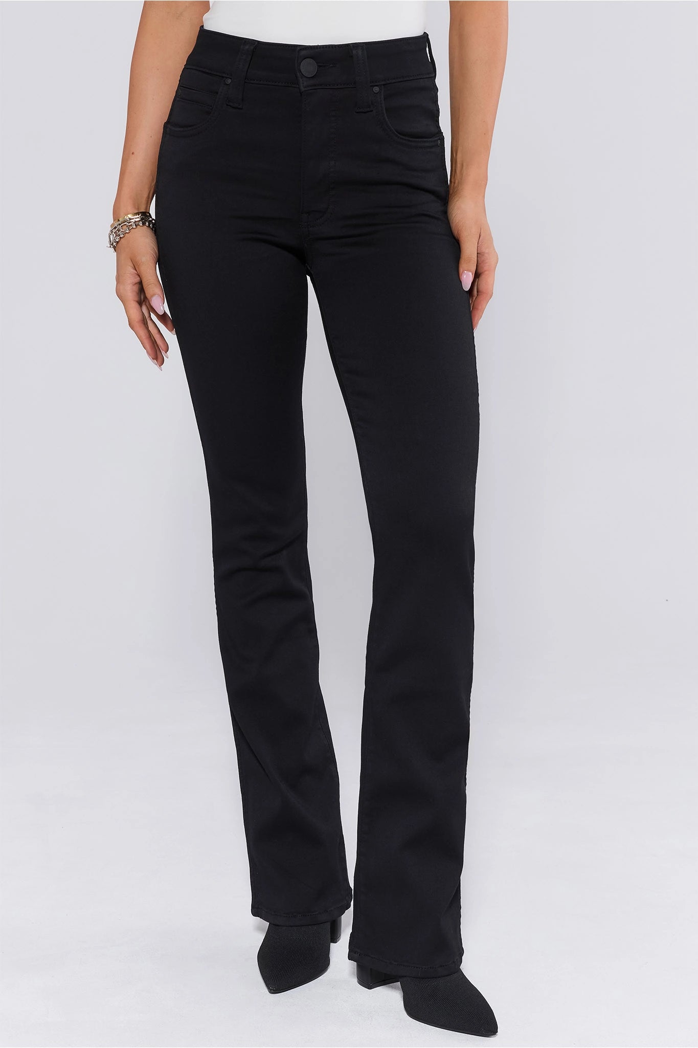Person wearing black Natalie Jeans on a white background