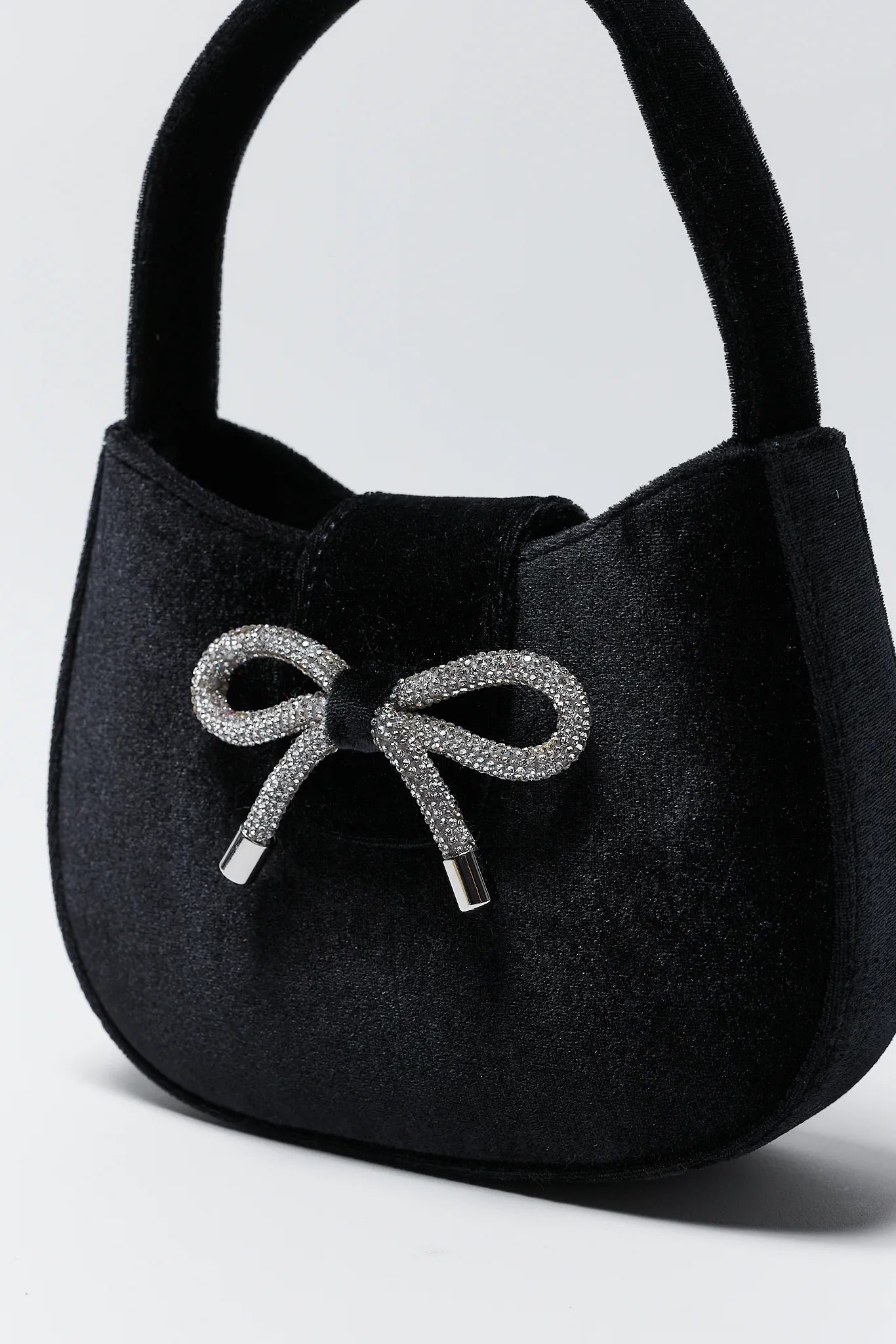 Nina Black Velvet Bag on a light gray background