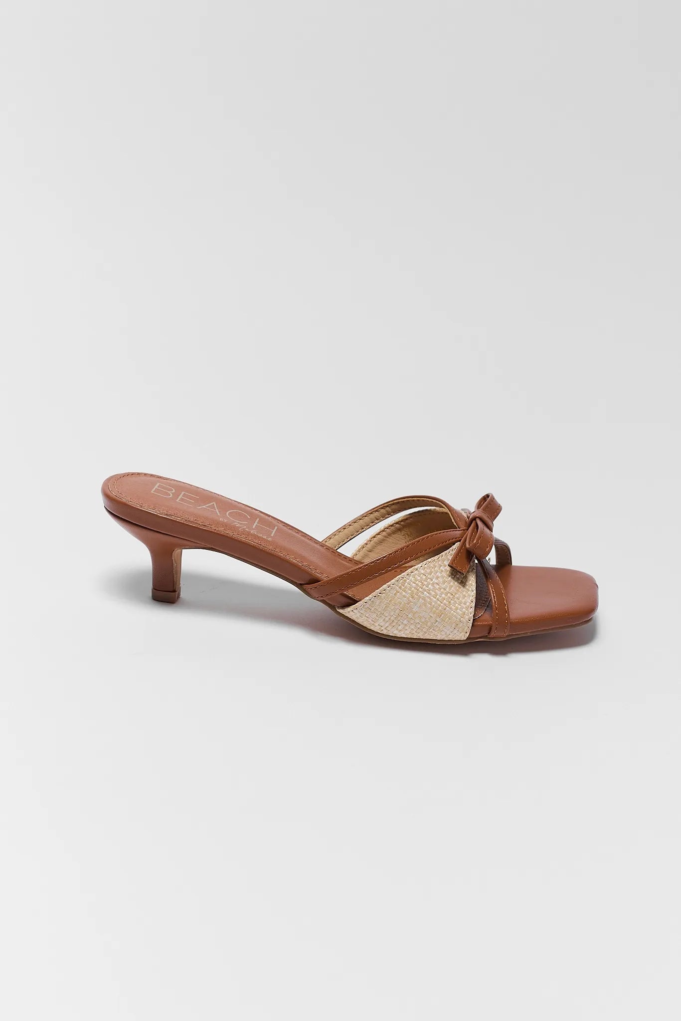 one Portia Brown Raffia Kitten Heels on white background