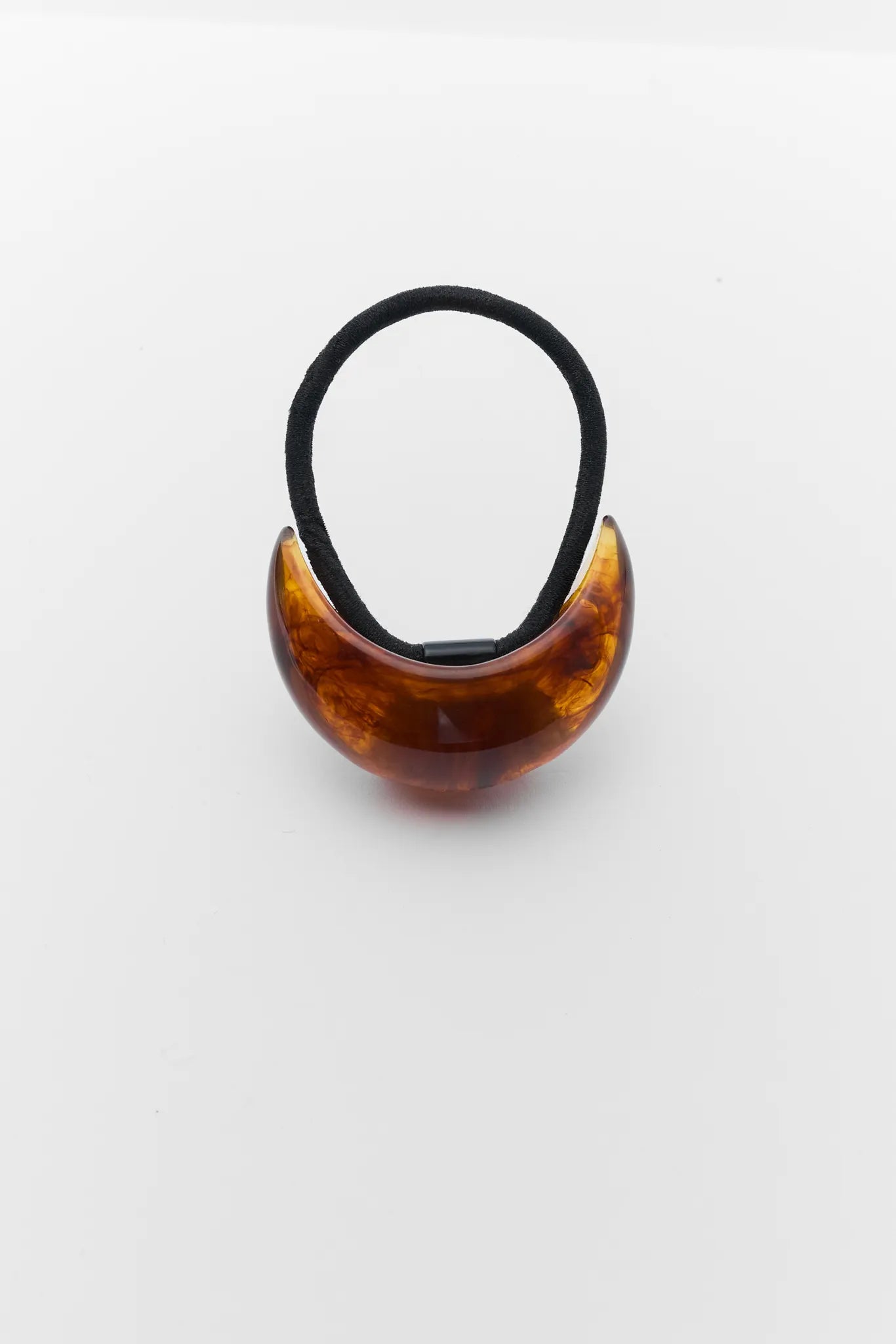Tortoiseshell hair tie on a white background